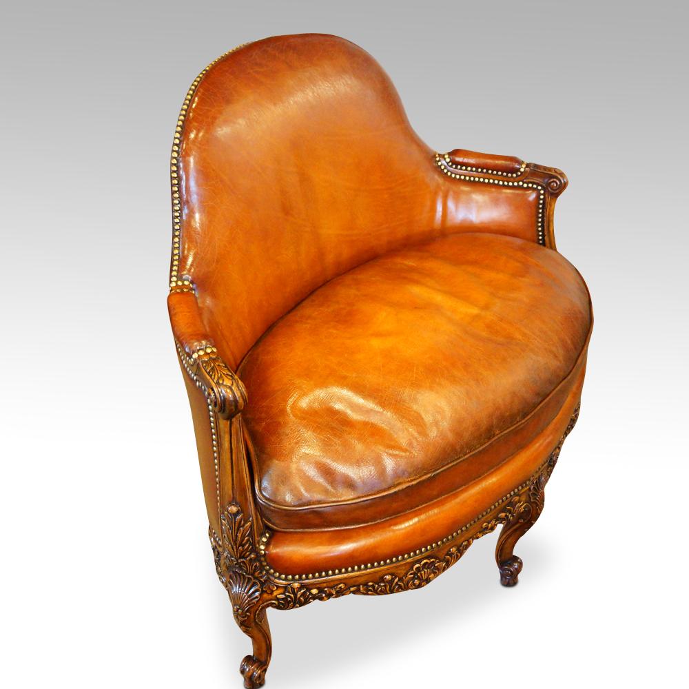 Edwardian walnut loveseat
This walnut love seat was made circa 1910. The frame is beautifully carved, the carving being very crisp.
It has a carved cabriole leg at the centre of the frame to the front and the rear, 
The apron is carved with shell