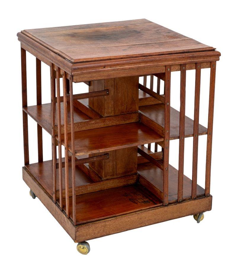 Edwardian Walnut Revolving Bookcase, early 20th century, on later casters. 29.25
