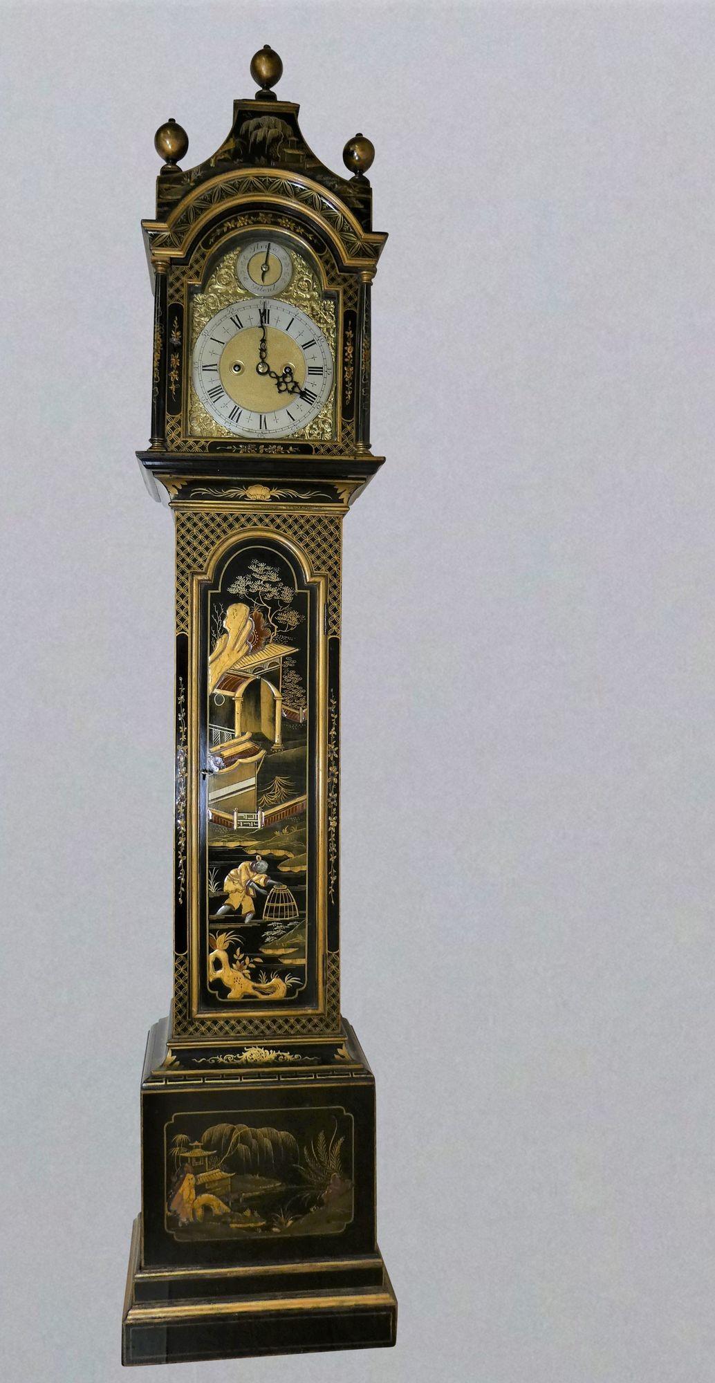 Edwardian weight driven chinoiserie decorated grandmother clock.
 
 
Edwardian Grandmother clock housed in a pagoda top case with raised Chinoiserie decoration on a black background. Raised, stepped plinth with inset panel to the base, long break
