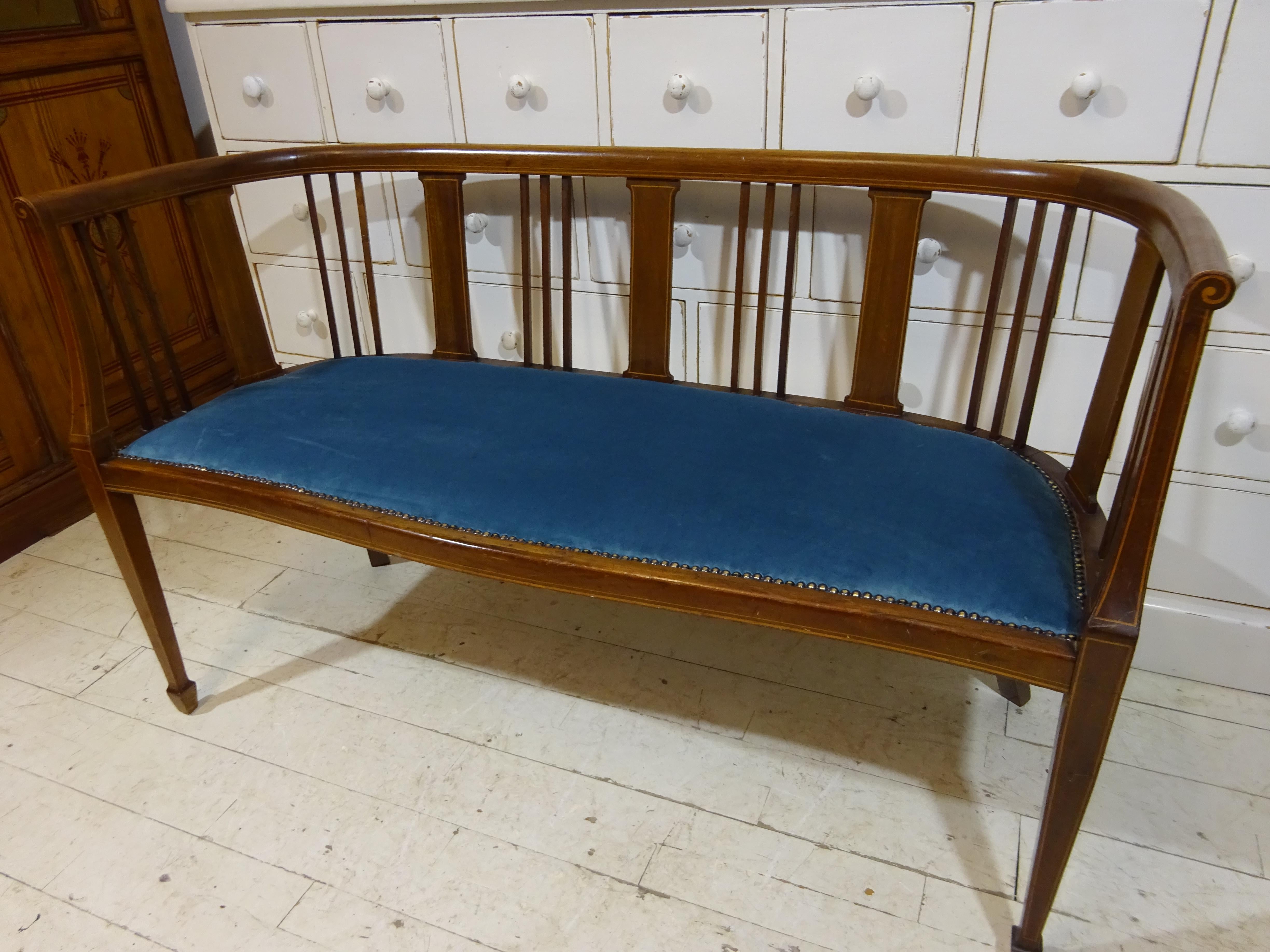 Antique Edwardian Window Seat 

This exquisite handmade Edwardian window chair or love seat is crafted from solid mahogany with inlaid fruitwood designs throughout and is sure to be a beautiful addition to any antique collection. It has been