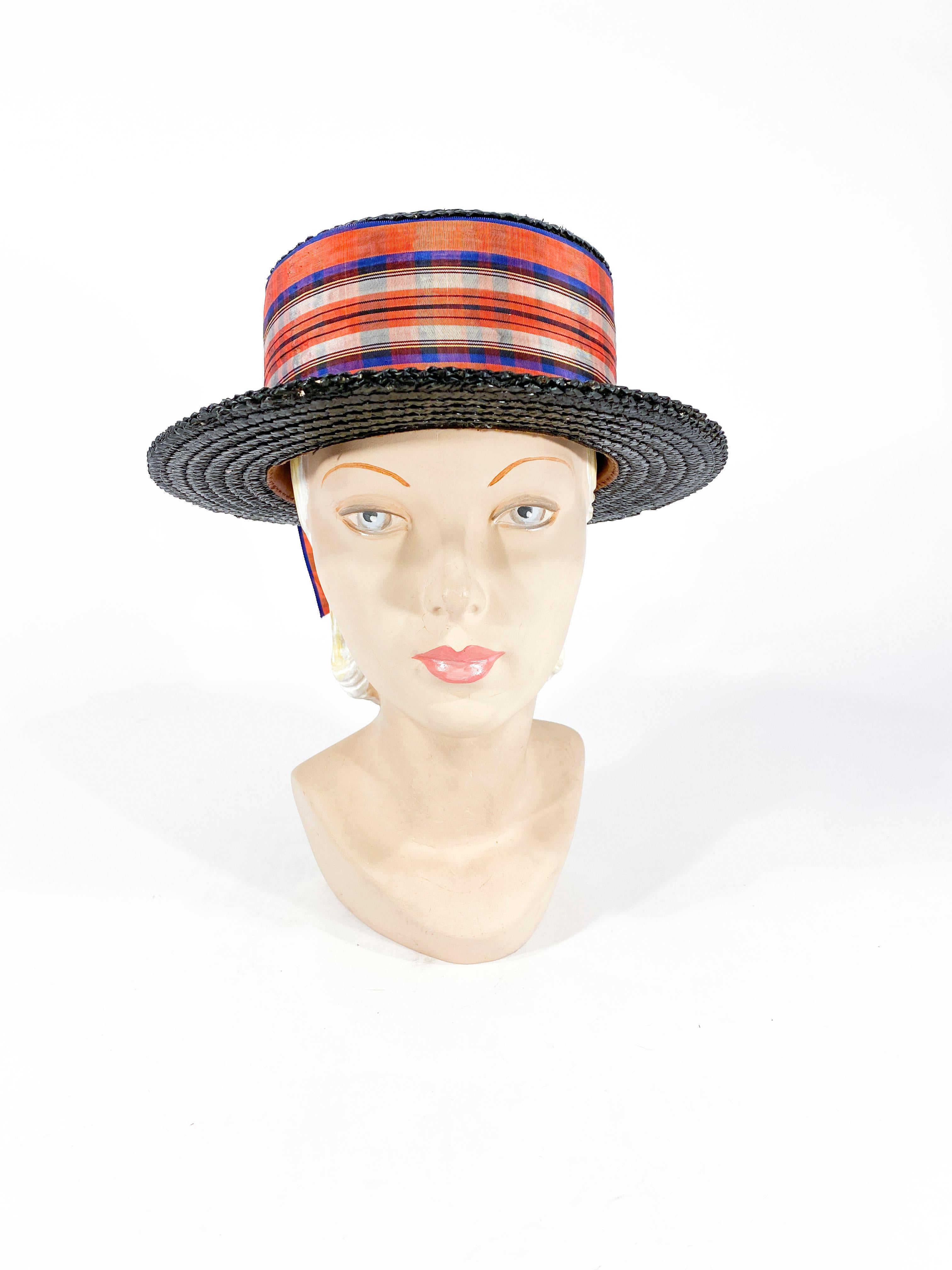 Edwardian woman's boater hat hand-painted black with an extra-wide multi-colored hat band finished with an enlarged bow. 