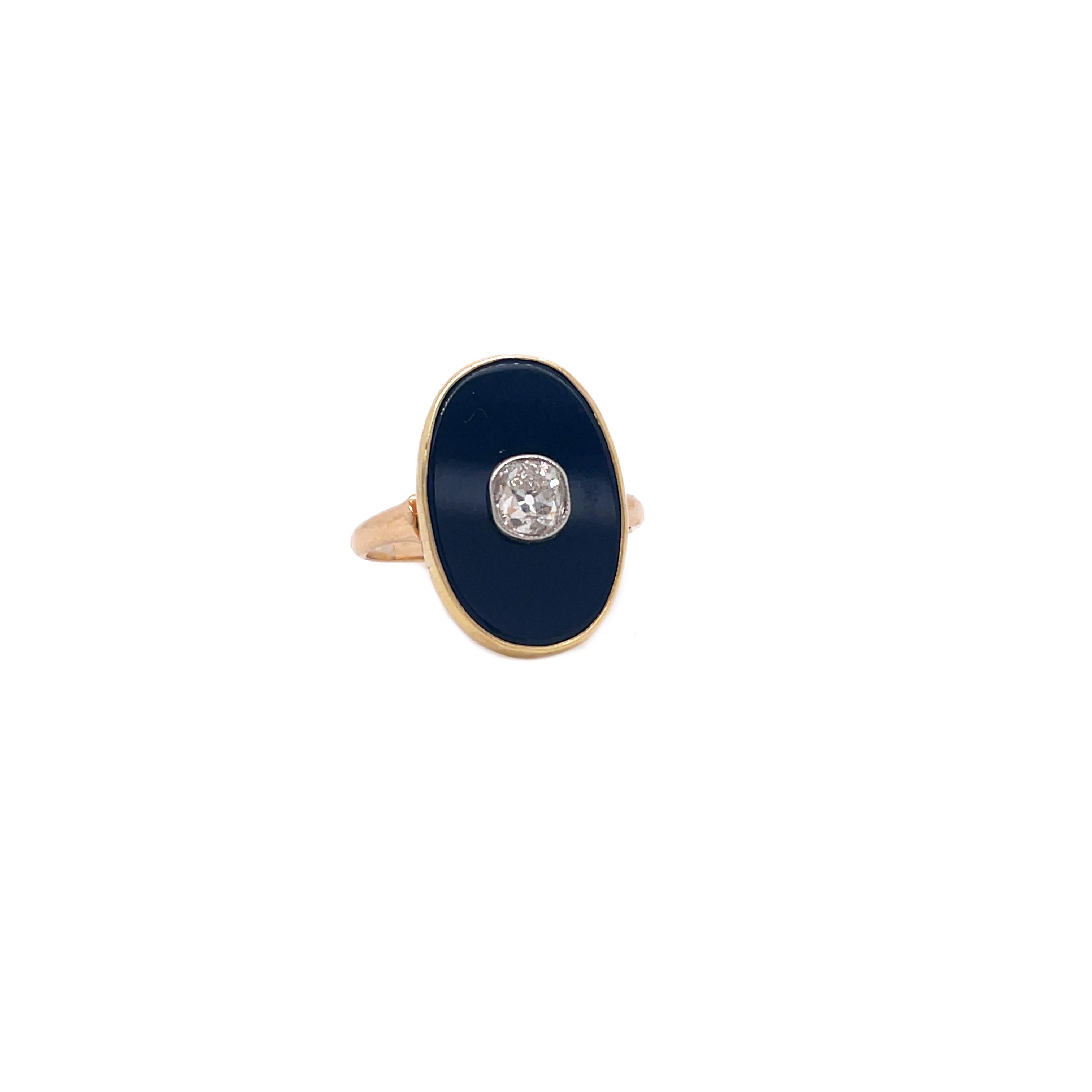 This stunning 1910 Edwardian ring is set in beautiful 18K yellow gold and features a dreamy old mine-cut diamond in a platinum bezel against a bold black onyx tablet. This is a fantastic ring that you can wear every day for any occasion! 

The