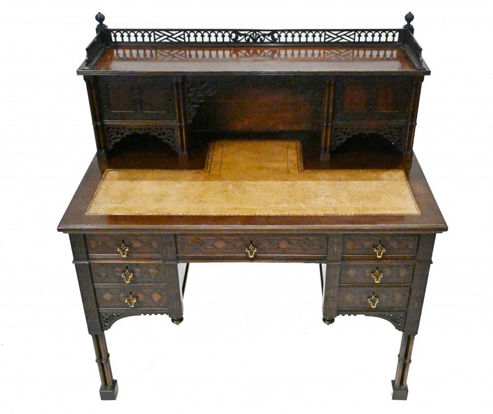 A finely carved mahogany desk in the Thomas chippendale style 
Supported on cluster legs with a  finely carved fretwork gallery top
Desk is made by Edwards and Roberts who were famous furniture makers working out of London
The Edwards and Roberts