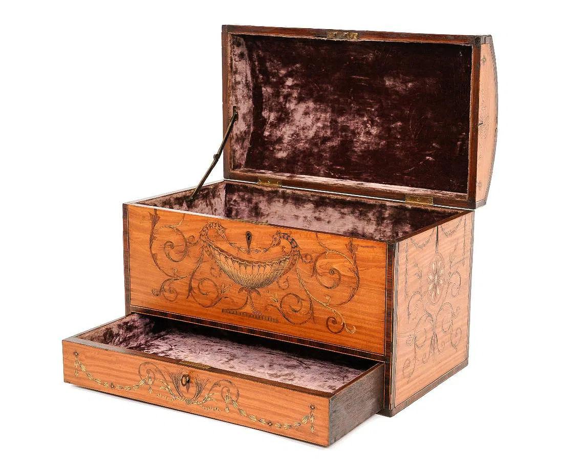 A fine dome-shaped satinwood box with a lower drawer is adorned with vases and floral swags, cross-banded in rosewood.

Maker: Edwards and Roberts

Edwards and Roberts, a prominent English antique furniture cabinet maker, emerged in the latter half