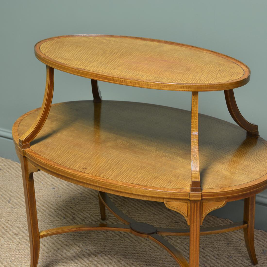 Superb quality Edwards & Roberts satinwood two tier occasional / lamp table

Constructed by the Renowned Makers Edwards and Roberts, this superb table is eye-catching due to the two oval tiers with crossbanded edges, boxwood and ebony string inlay