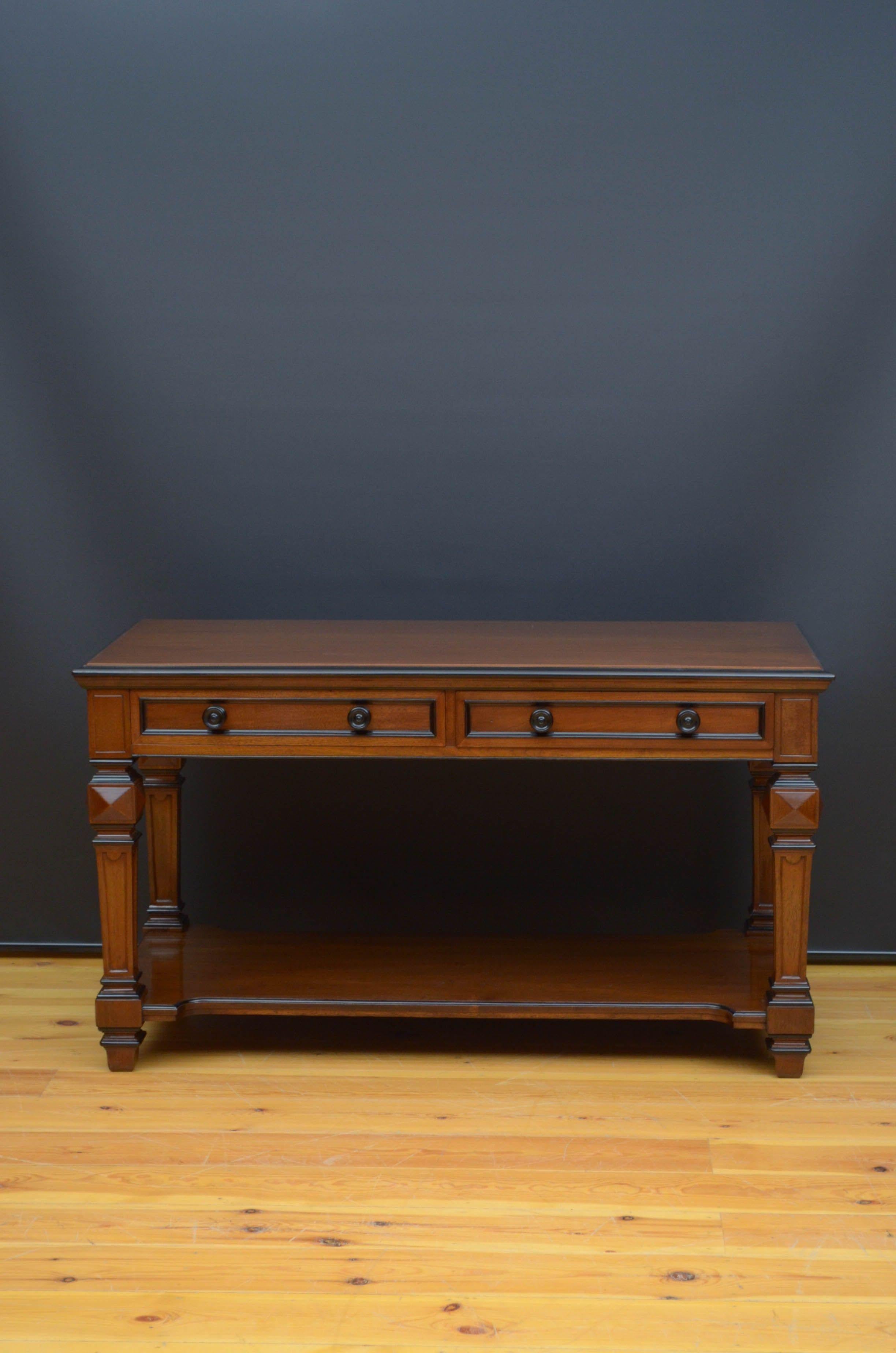 R05 impressive Edwards & Roberts walnut table, having figured top with moulded and ebonised edge above two panelled frieze drawers fitted with original ebonised knobs, all standing on substantial, carved legs with diamond shaped decoration