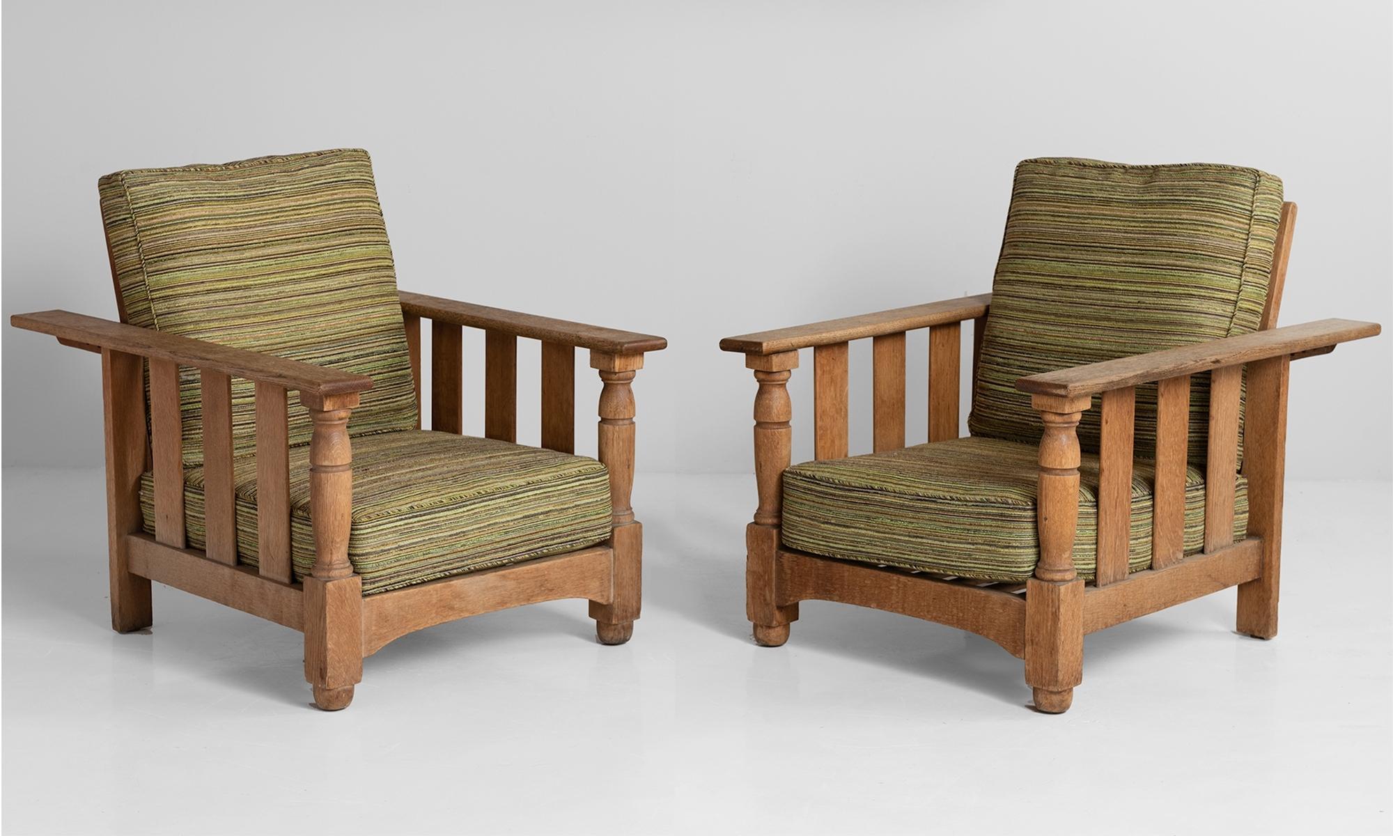 Edwarian Oak Reclining Armchairs, England, circa 1915.

Pair of newly upholstered armchairs with adjustable backs, produced by Heals of London.