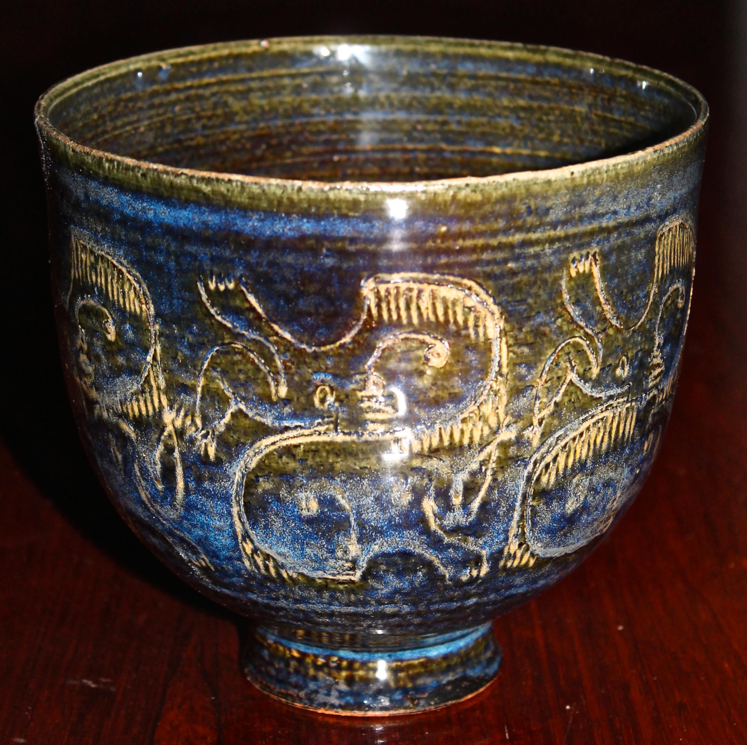 Beautiful richly colored and decorated blue bowl.