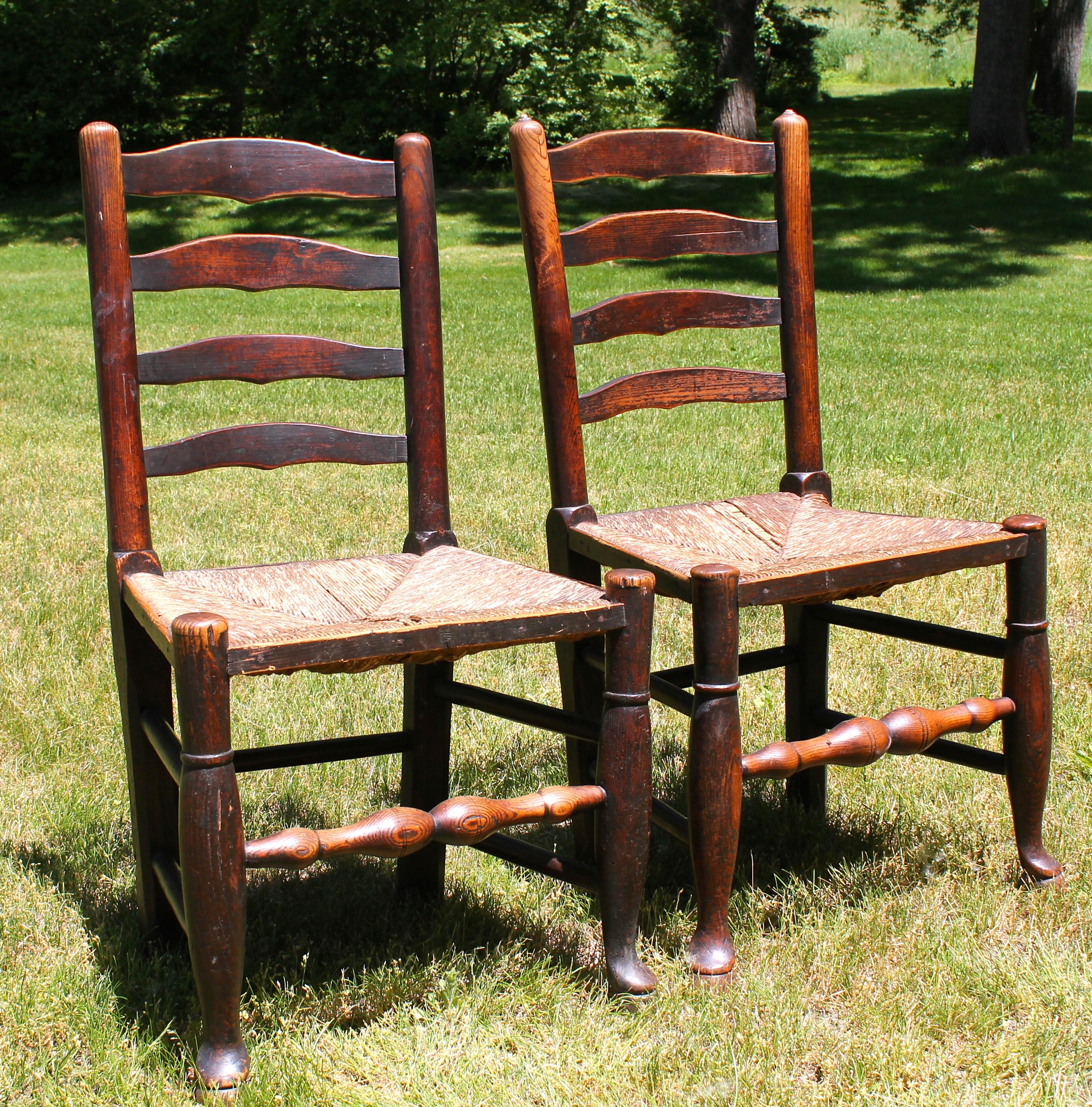 Beautiful pair with rich early and untouched patina. Early if not original woven rush seats.