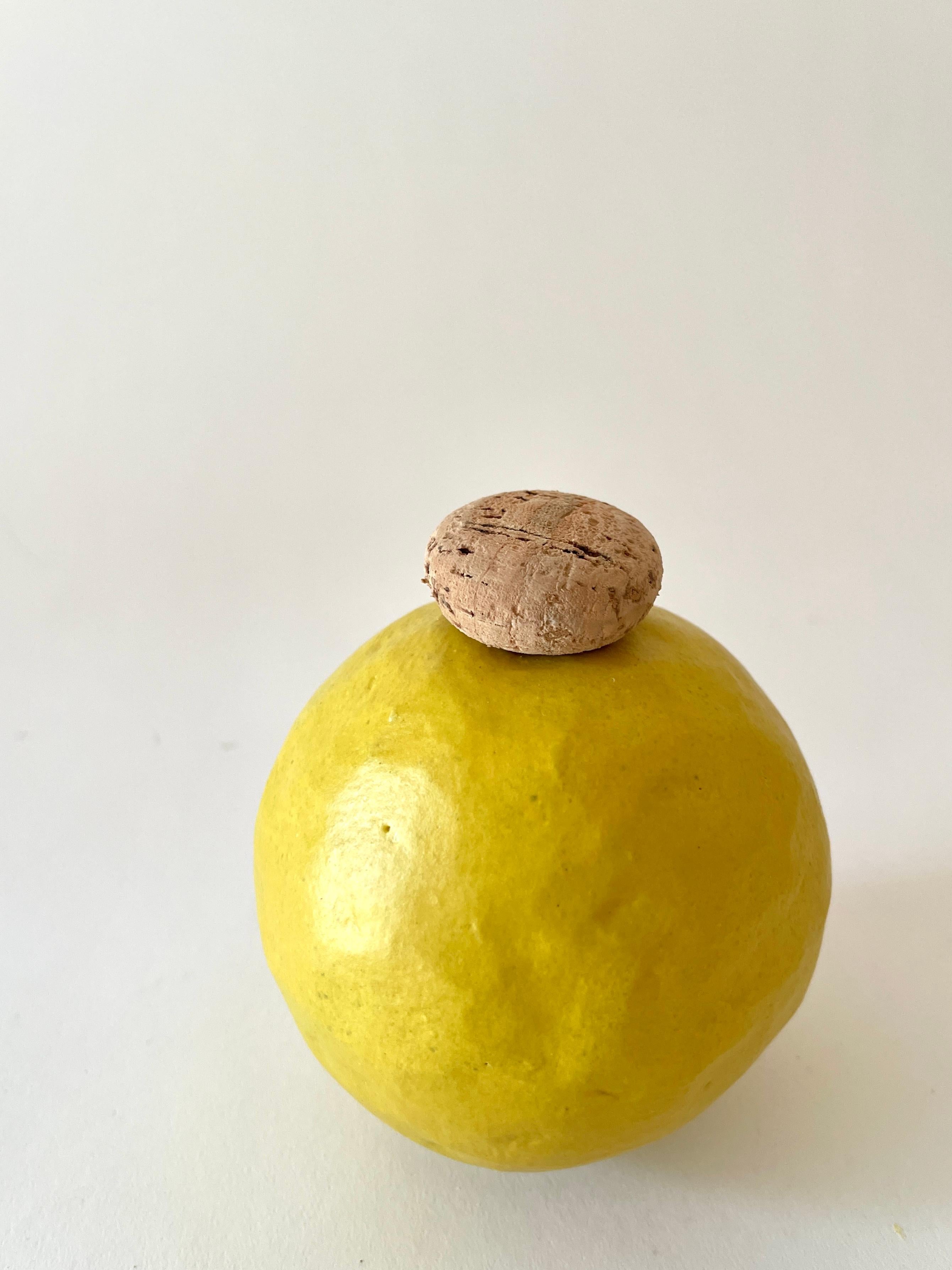 Edwina yellow vase by Meg Morrison
One of a kind.
Materials: Ceramic, cork.
Dimensions: Ø 10 x H 13 cm.

All sizes are approximate. Although vases are watertight condensation may form on the bottom. Please protect delicate surfaces.

Meg