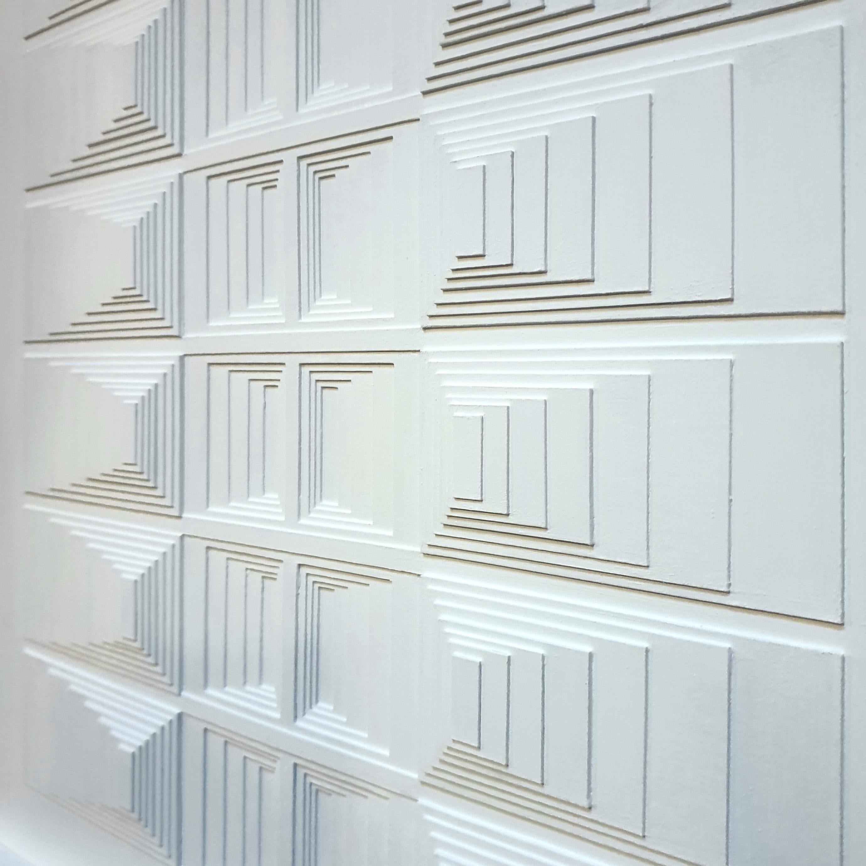 BB1121W is a unique one-of-a-kind contemporary modern painting relief by Dutch artist Eef de Graaf. The relief is made from meticulously hand cut cardboard elements finished with a matt white acrylic paint. This art work is mounted in a simple white