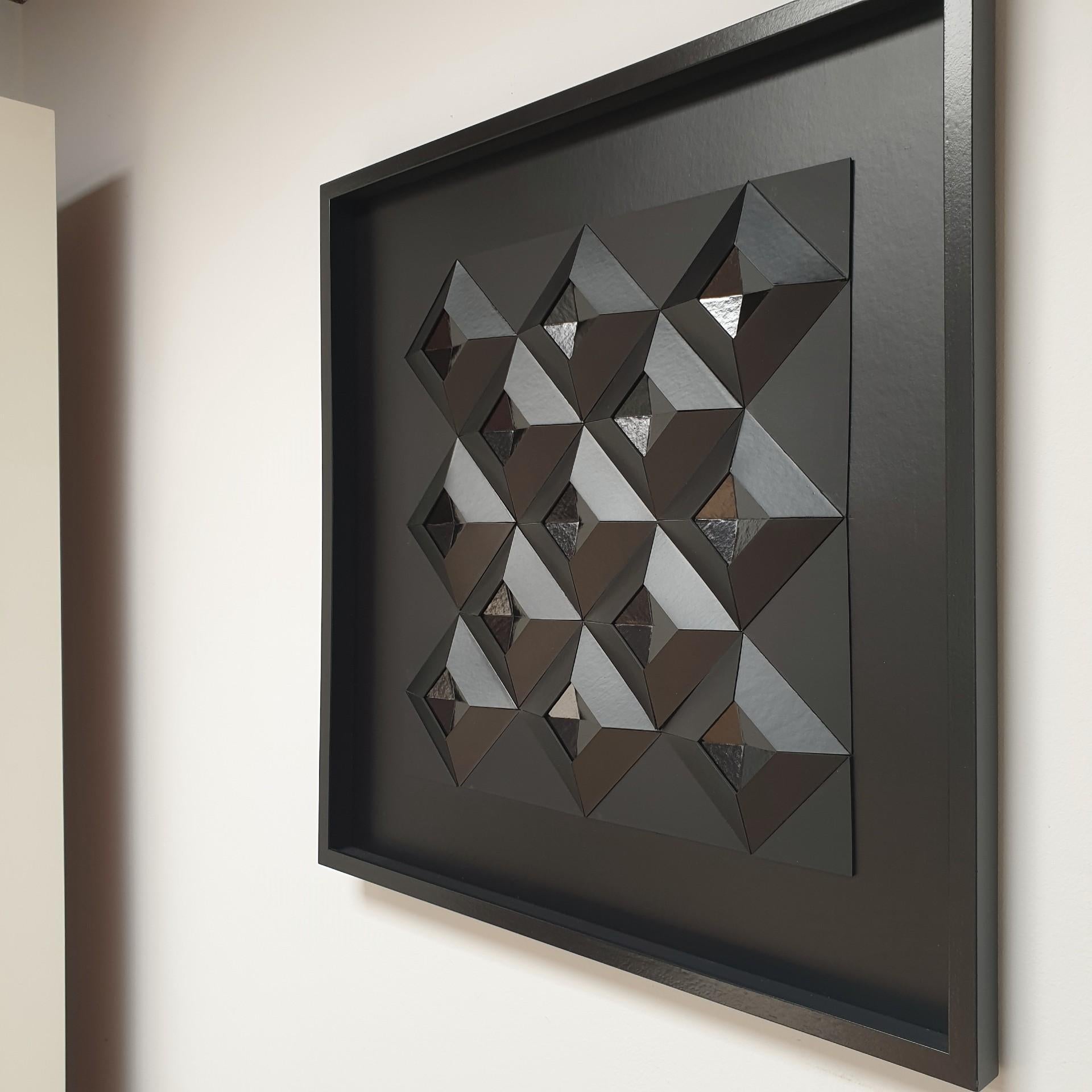 Diamond shape variation no. 6 is a unique one-of-a-kind contemporary modern painting relief by Dutch artist Eef de Graaf. The relief is made from meticulously hand-cut plain black cardboard elements that are hand-mounted together forming thirteen