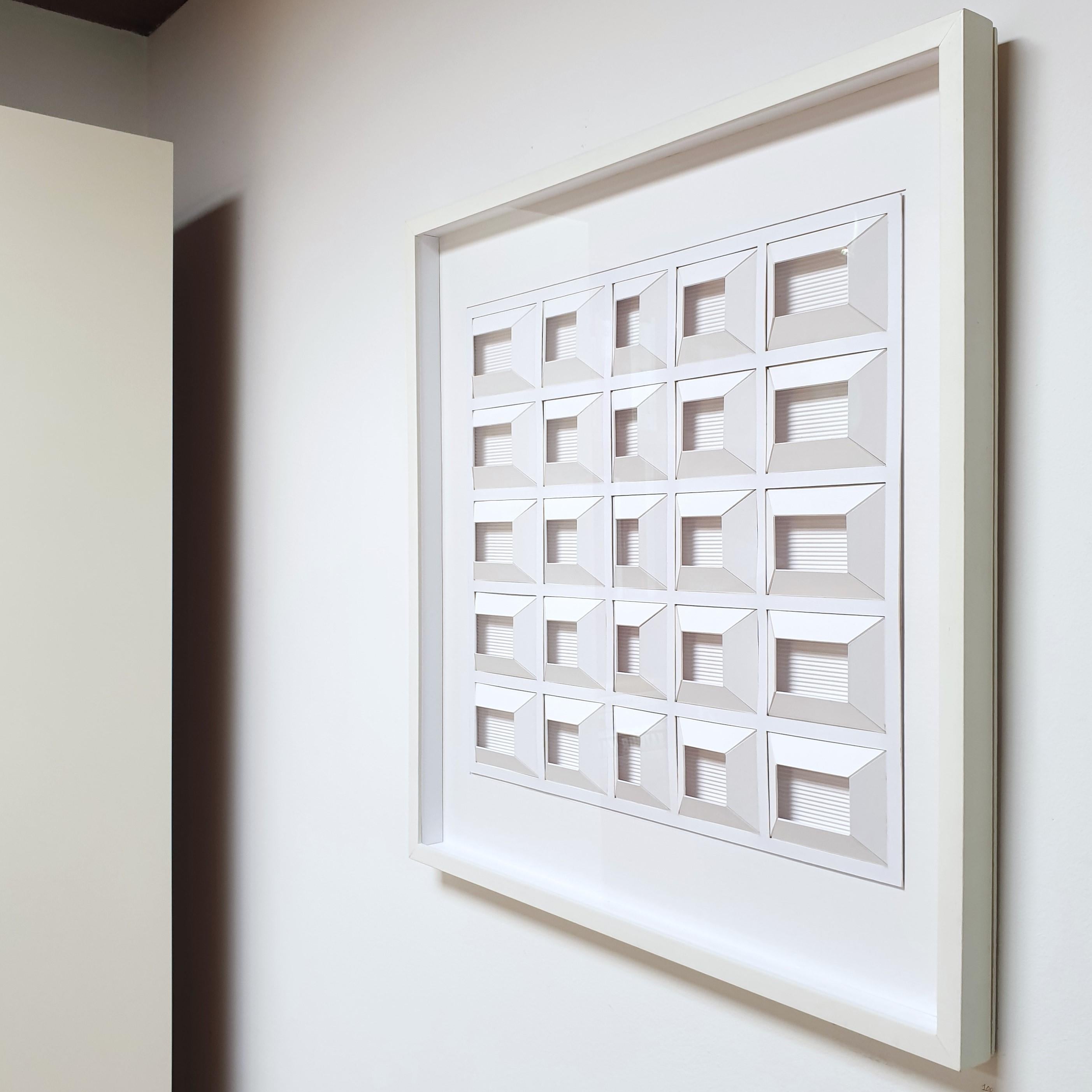 Geometric process white E is a unique one-of-a-kind contemporary modern painting relief by Dutch artist Eef de Graaf. The relief is made from meticulously hand-cut plain white cardboard elements that are hand-mounted together forming twenty-five