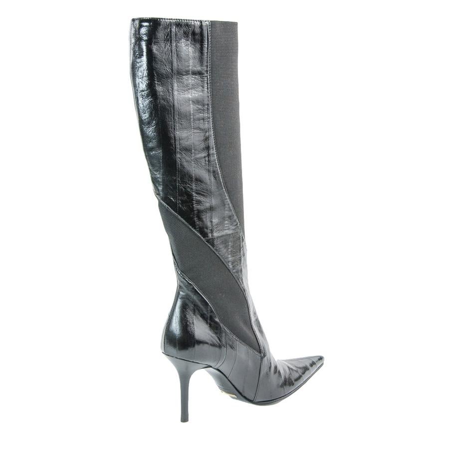 Eel and textile Black color Heel height 9 cm (3.5 inches)
