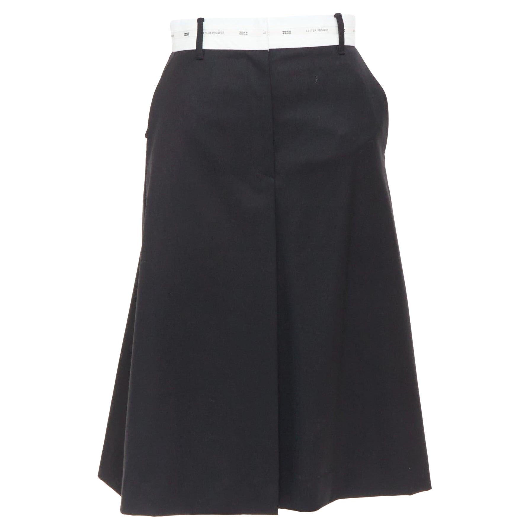 EENK LETTER X black white wool blend logo waist box pleat knee skirt XS For Sale