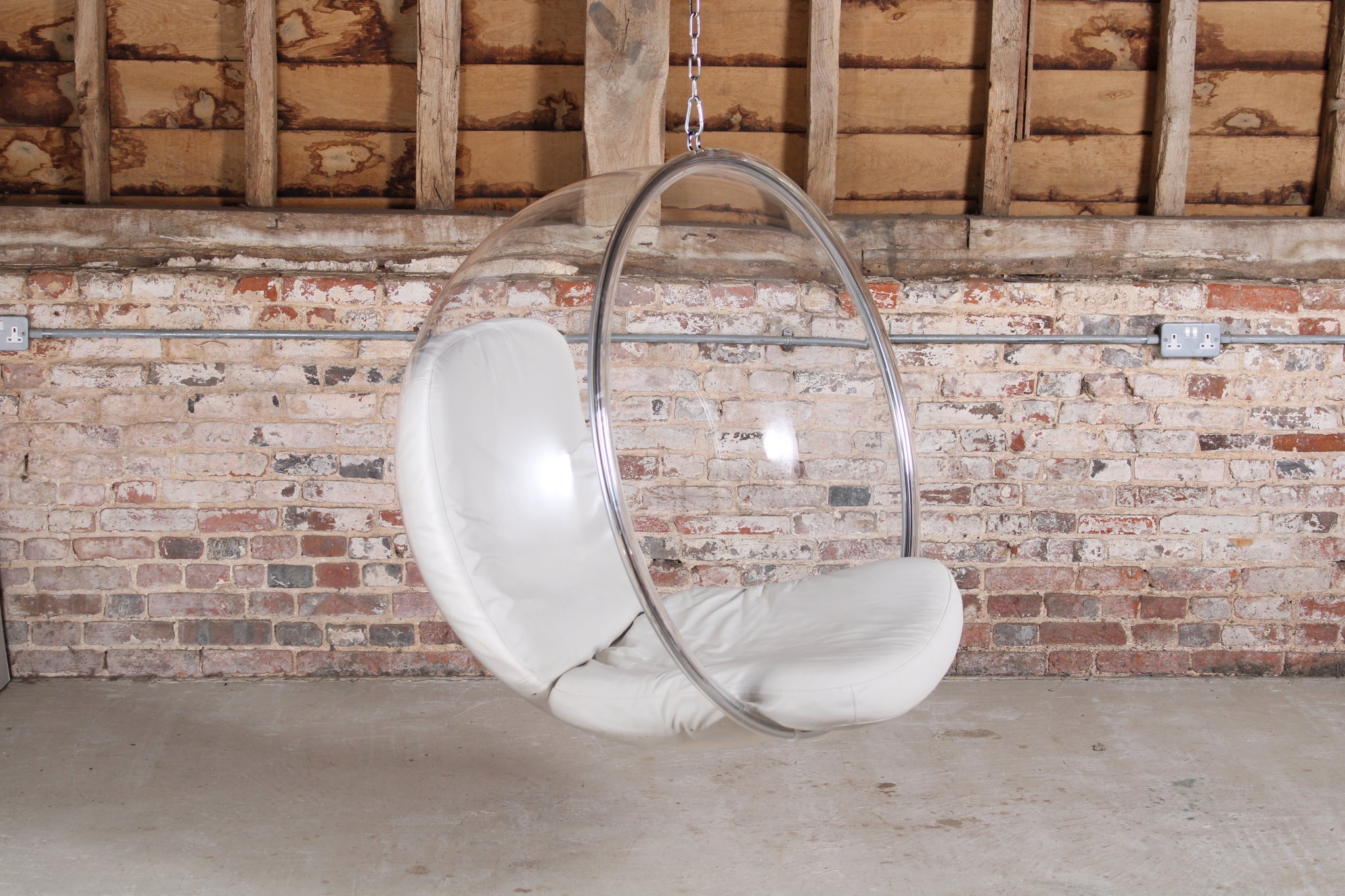 The Bubble chair was designed by Eero Aarnio in 1968. According to Eero’s notes, the Bubble hangs from the ceiling because ‘there is no nice way to make a clear pedestal.’ It shares the same unique acoustics as the Ball Chair, a little cocoon that