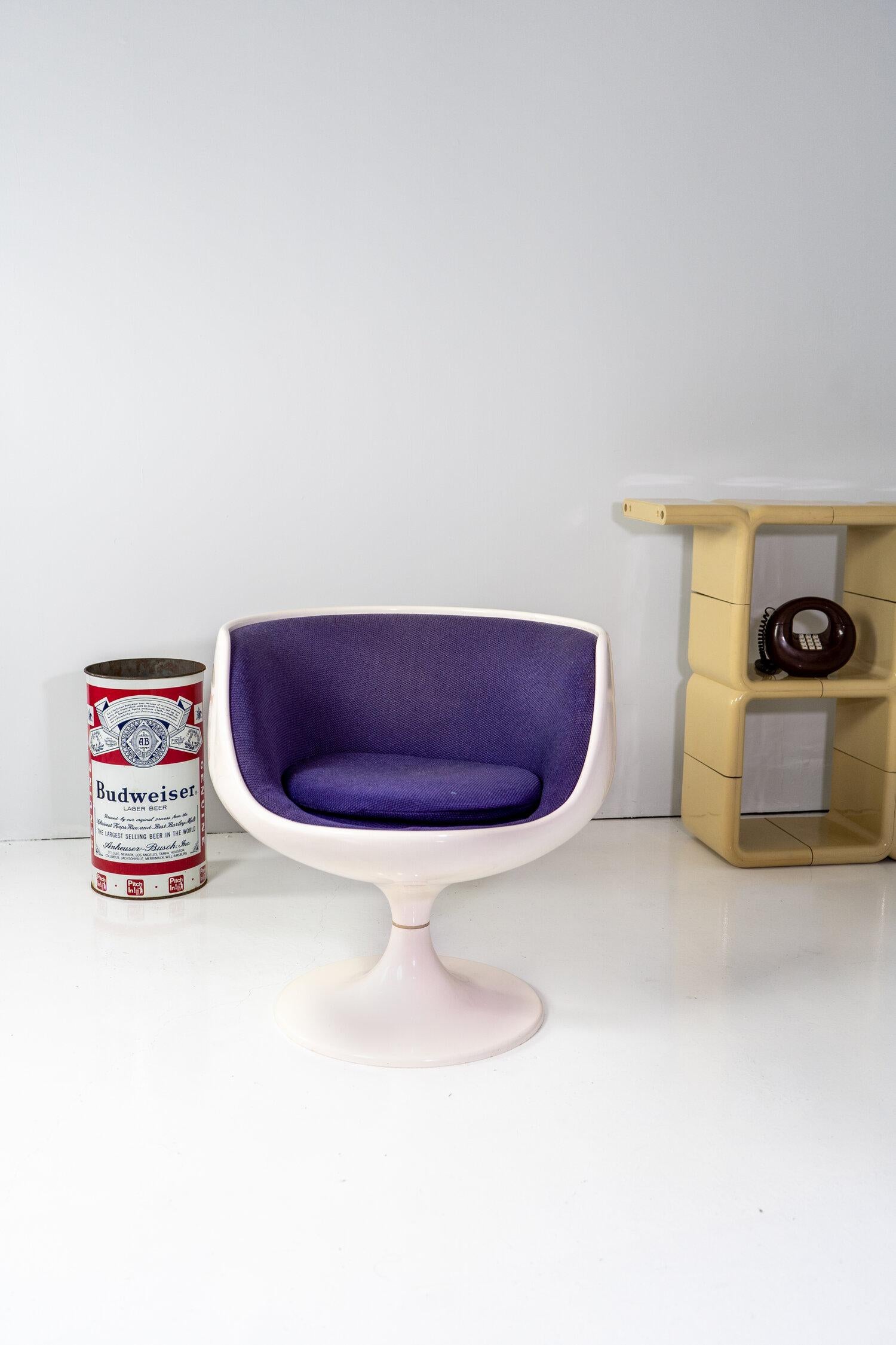 Fiberglass shell and base with original purple upholstery.