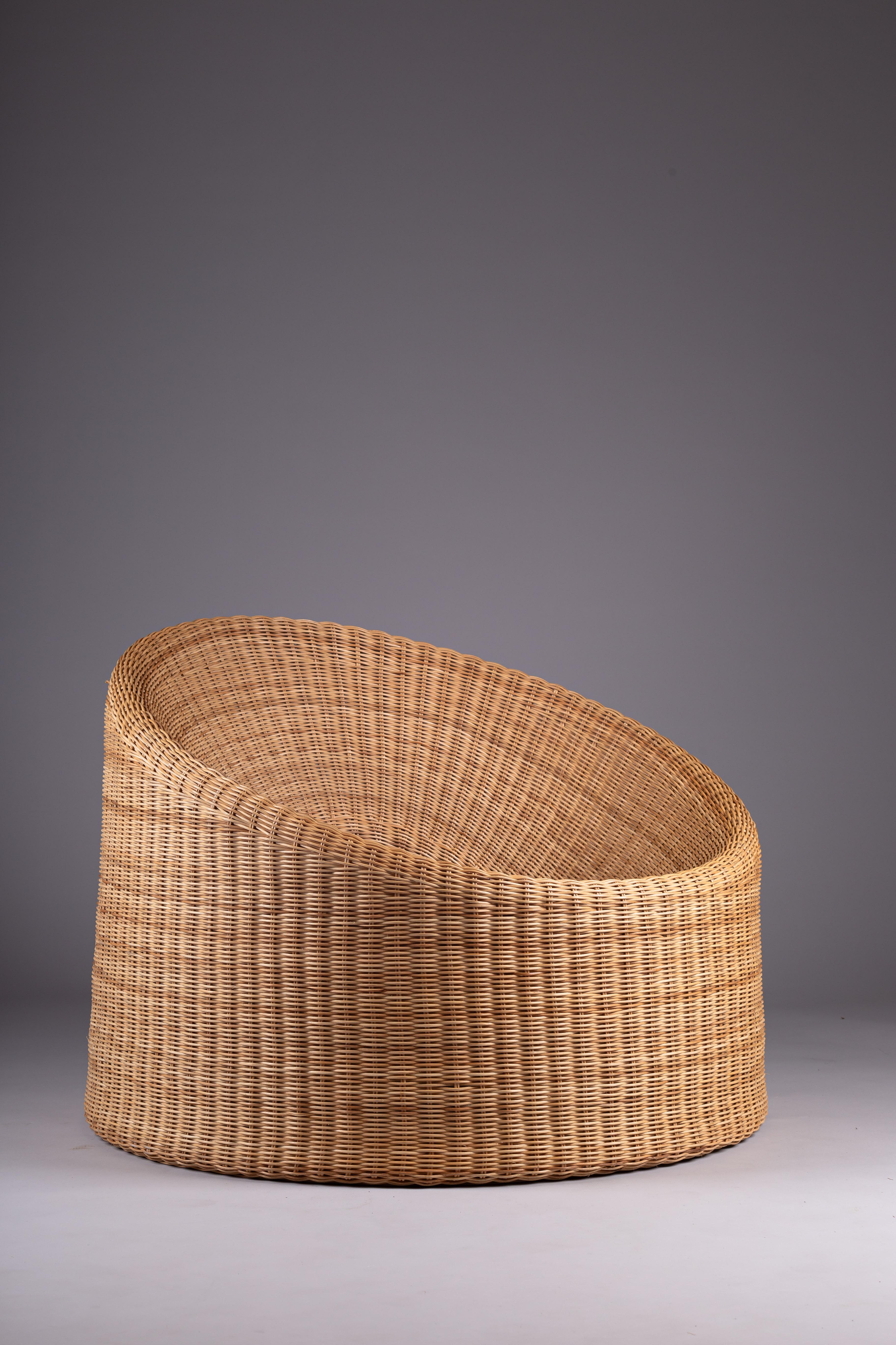 Introducing the iconic Eero Aarnio Elephant Boot Rattan Chair, a true symbol of Finnish design innovation. This piece showcases the playful and imaginative style of Eero Aarnio, a visionary designer known for his unique and groundbreaking furniture