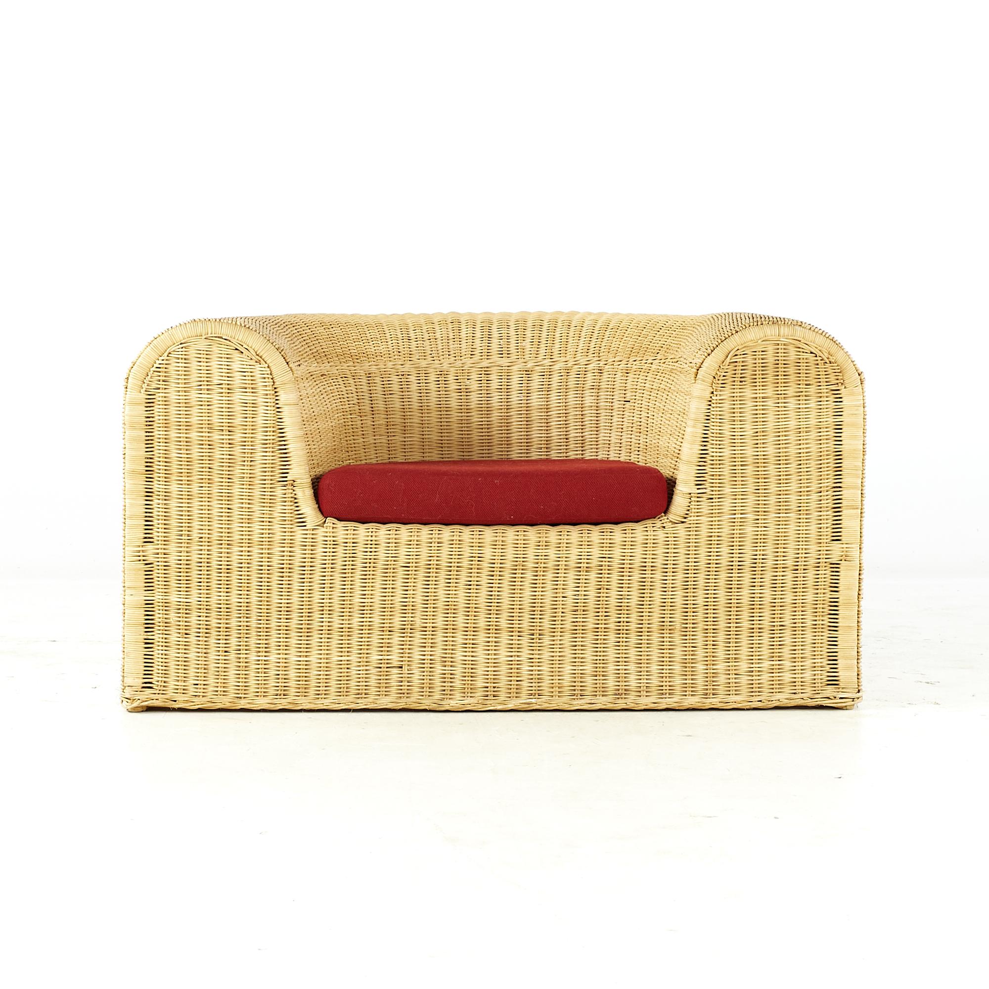 Eero Aarnio midcentury rattan lounge chair.

This chair measures: 45 wide x 32 deep x 24 high, with a seat height of 14.5 and arm height/chair clearance 24 inches

All pieces of furniture can be had in what we call restored vintage condition.