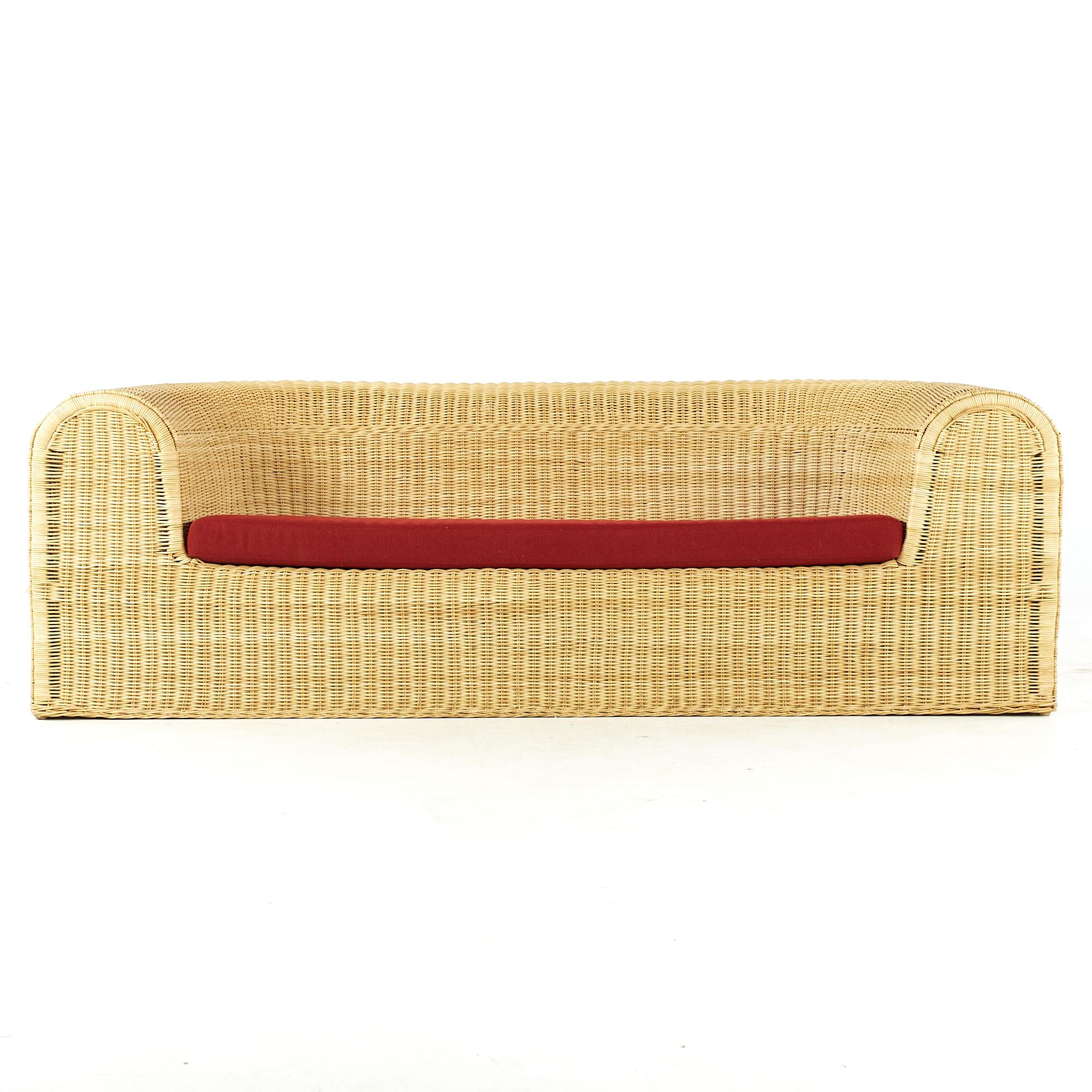 Eero Aarnio midcentury rattan sofa

This sofa measures: 76 wide x 32 deep x 24.5 inches high, with a seat height of 14.5 and arm height of 24.5 inches

All pieces of furniture can be had in what we call restored vintage condition. That means the