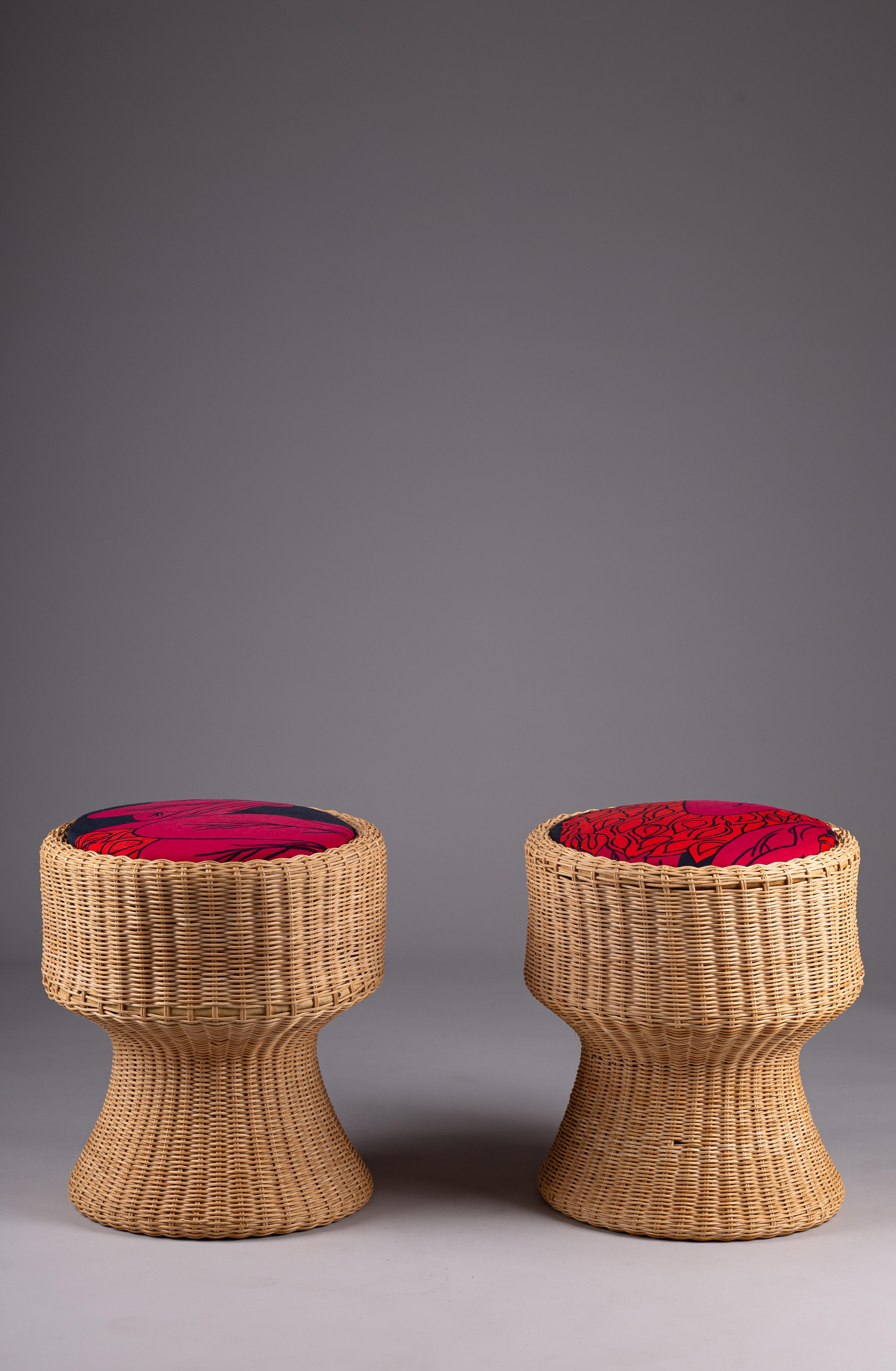 Embrace the timeless beauty of Scandinavian craftsmanship with this exquisite pair of rattan Juttu stools by the legendary designer Eero Aarnio. These stools exude a natural elegance, crafted from high-quality rattan that combines durability with a