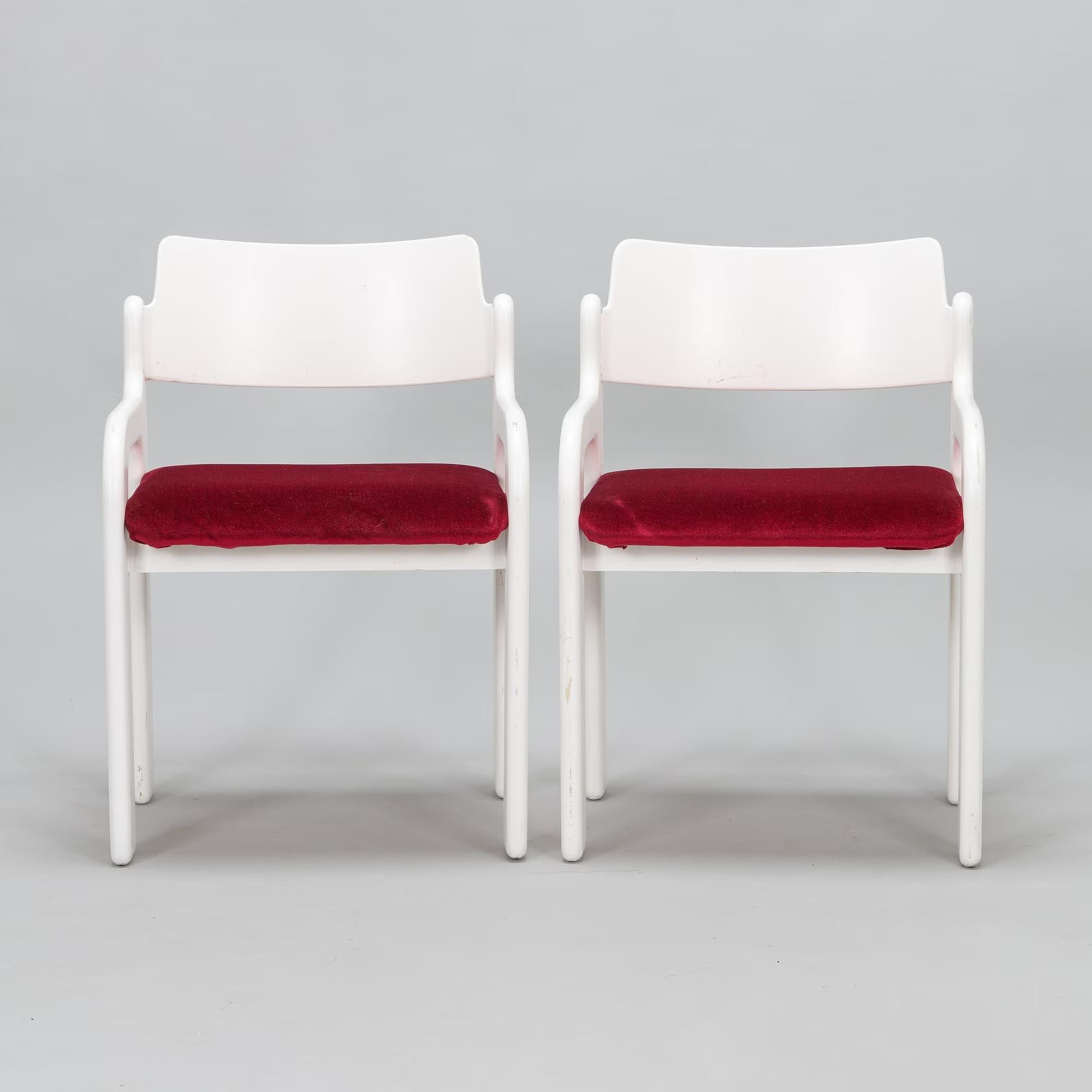 A set of : 4 lacquered white birch wood with brown velvet and 2 lacquered white birch wood with red velvet.

The flamingo chairs are probably most well known as a complete dining table set, together with a sideboard and extendable dining