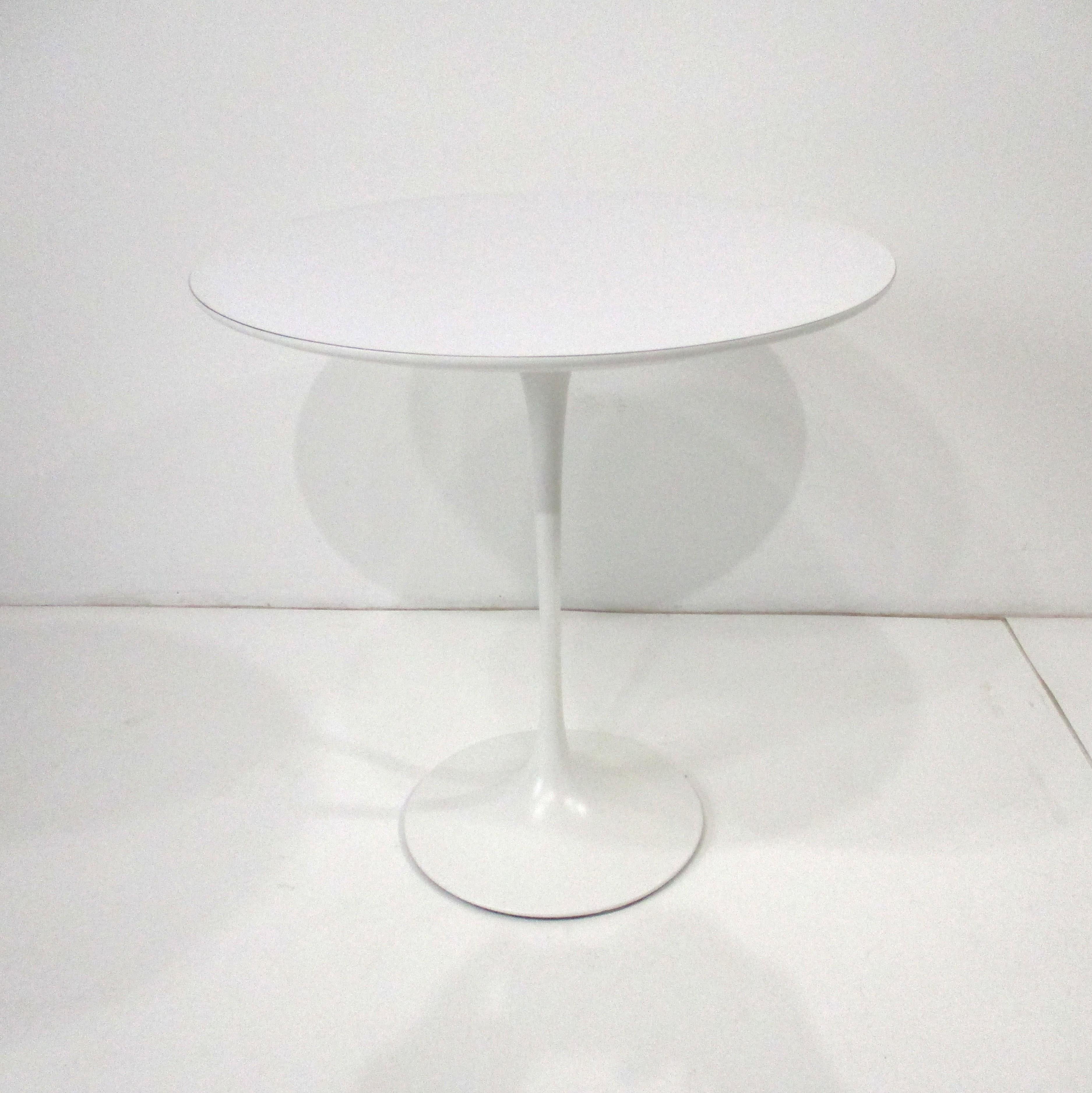 A iconic sculptural tulip side table with a bigger sized 20
