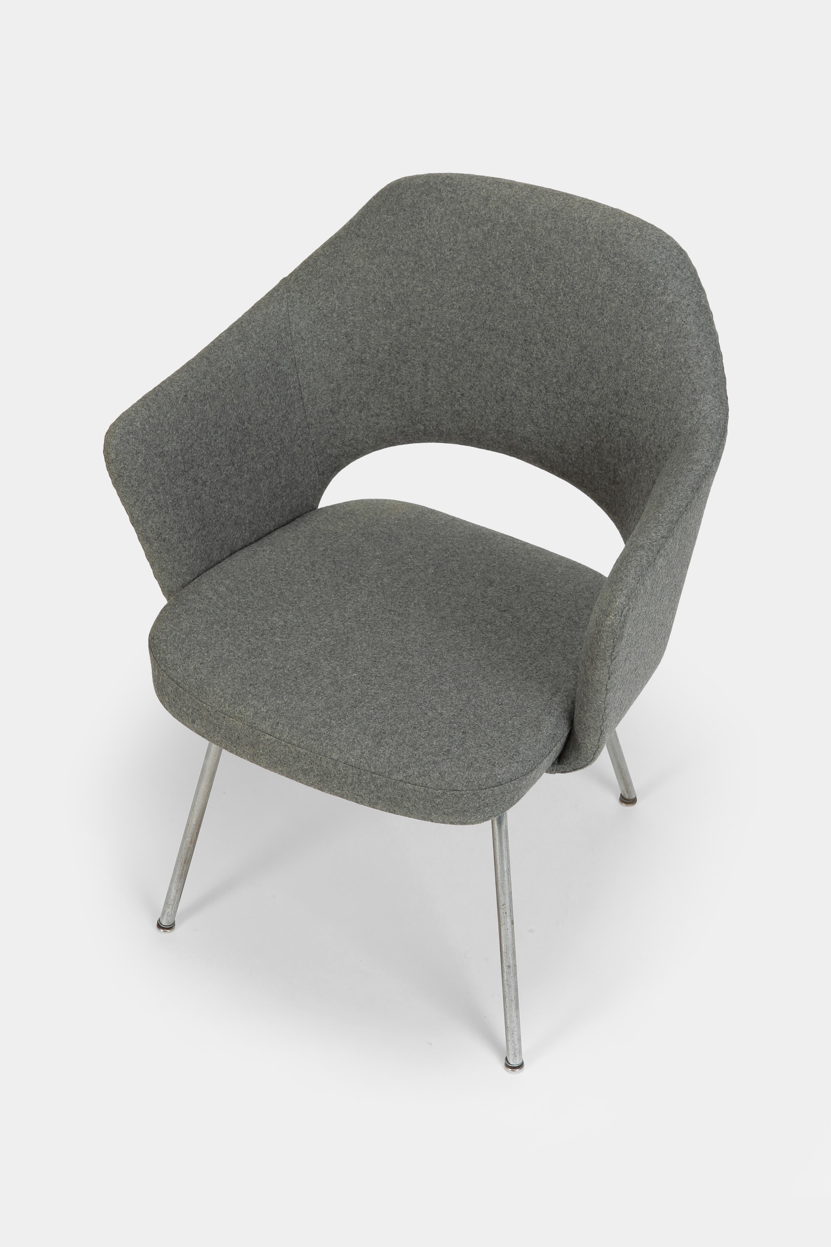 Eero Saarinen executive chair made by Knoll International in the 1960s. Classic design made to a high standard, freshly upholstered and covered with a new grey flannel fabric.