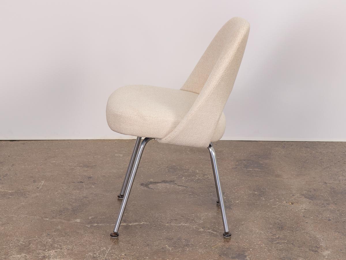 Eero Saarinen executive armless chair for Knoll. Inspired by his Womb chair design, the molded chair back melds to the sitter for the most comfortable fit. Our 1960s example has been newly upholstered in a creamy Knoll fabric that’s soft to the