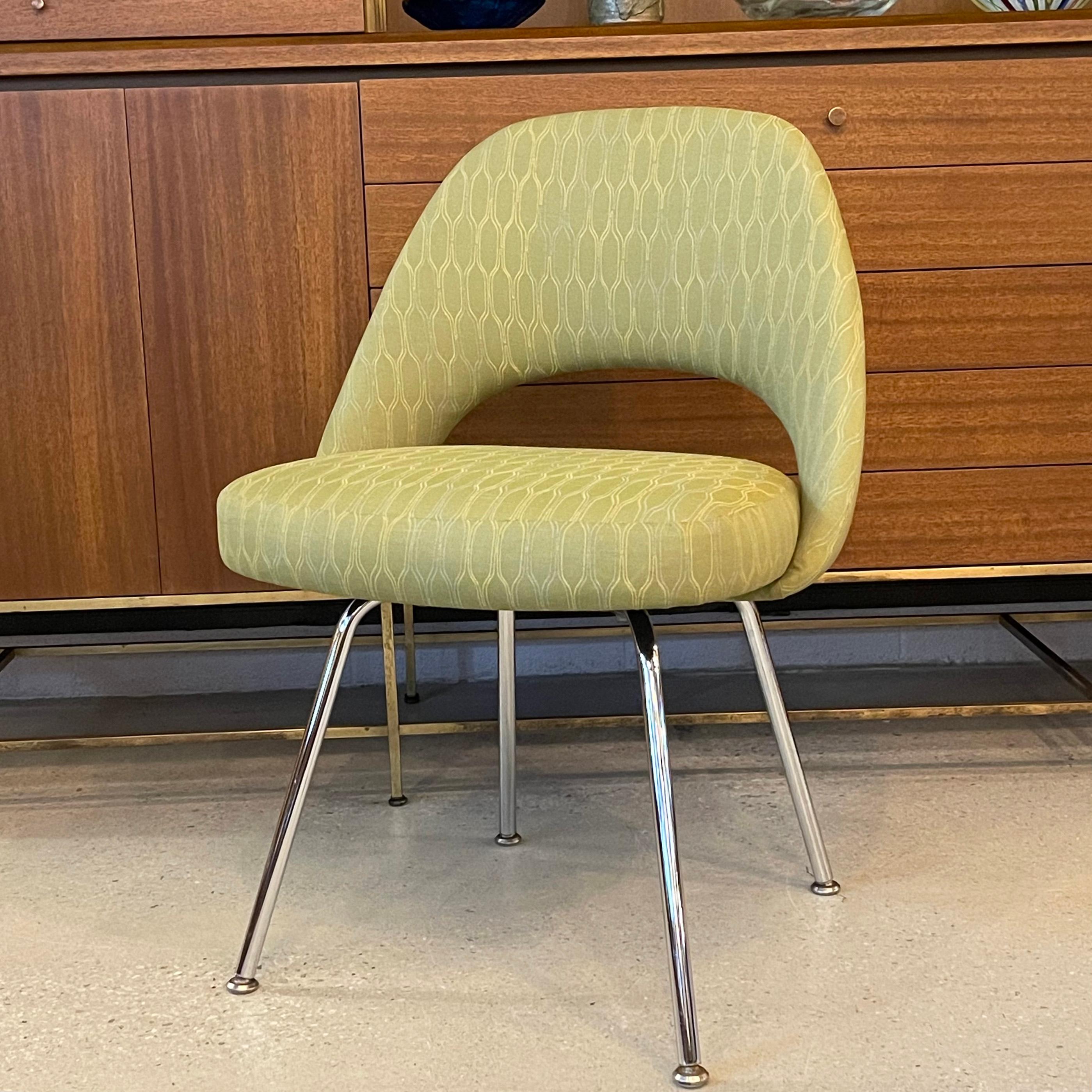 Executive side chair by Eero Saarinen for Knoll features green print, linen blend upholstery with chrome legs. This iconic chair is extremely comfortable and is the epitome of mid-century modern design. 
