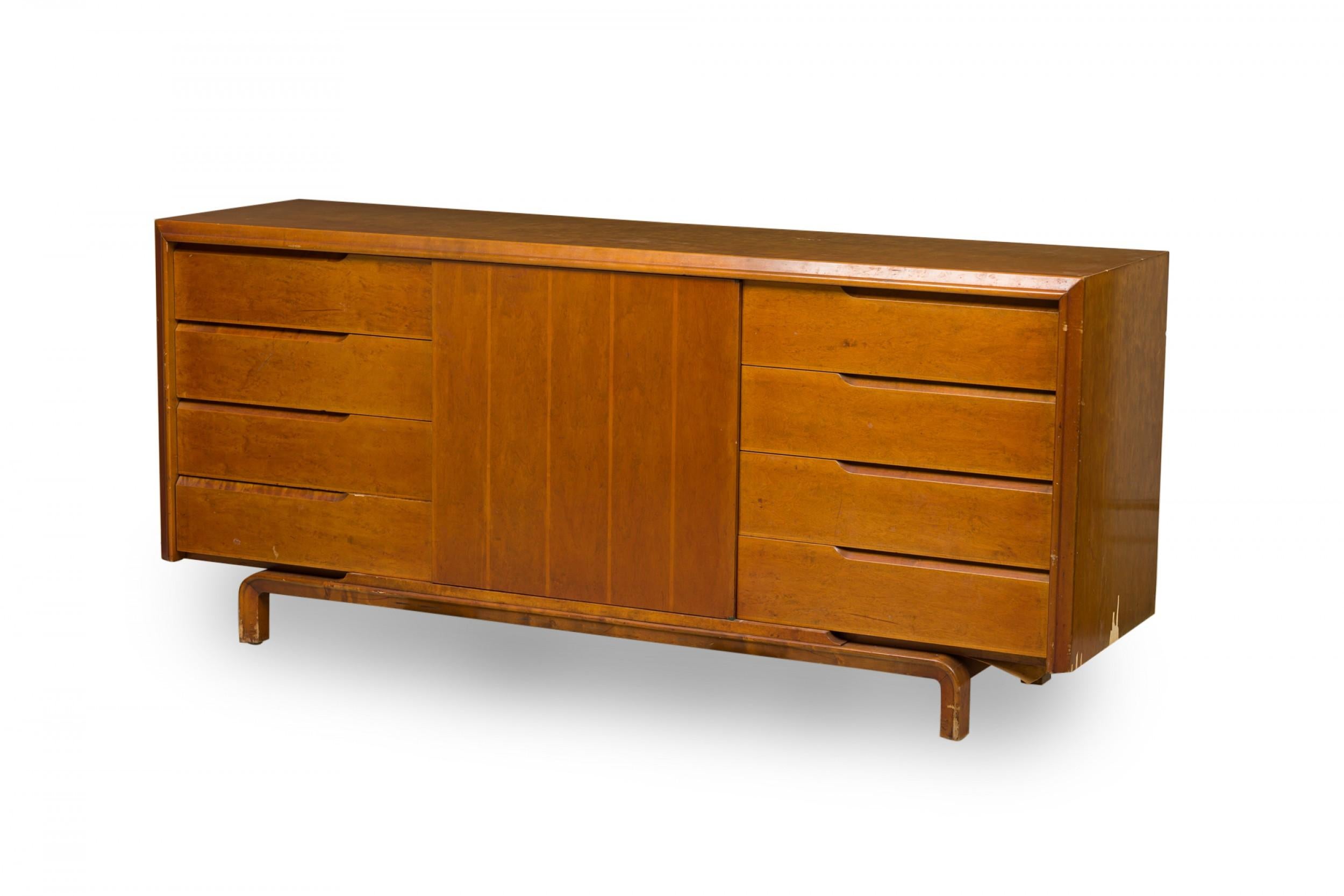 Finnish Mid-Century Modern birch and maple veneer sideboard / dresser with a central cabinet with a door subtly decorated with vertical striped inlay which opens to reveal a two compartment and single drawer interior, flanked on either side by a set