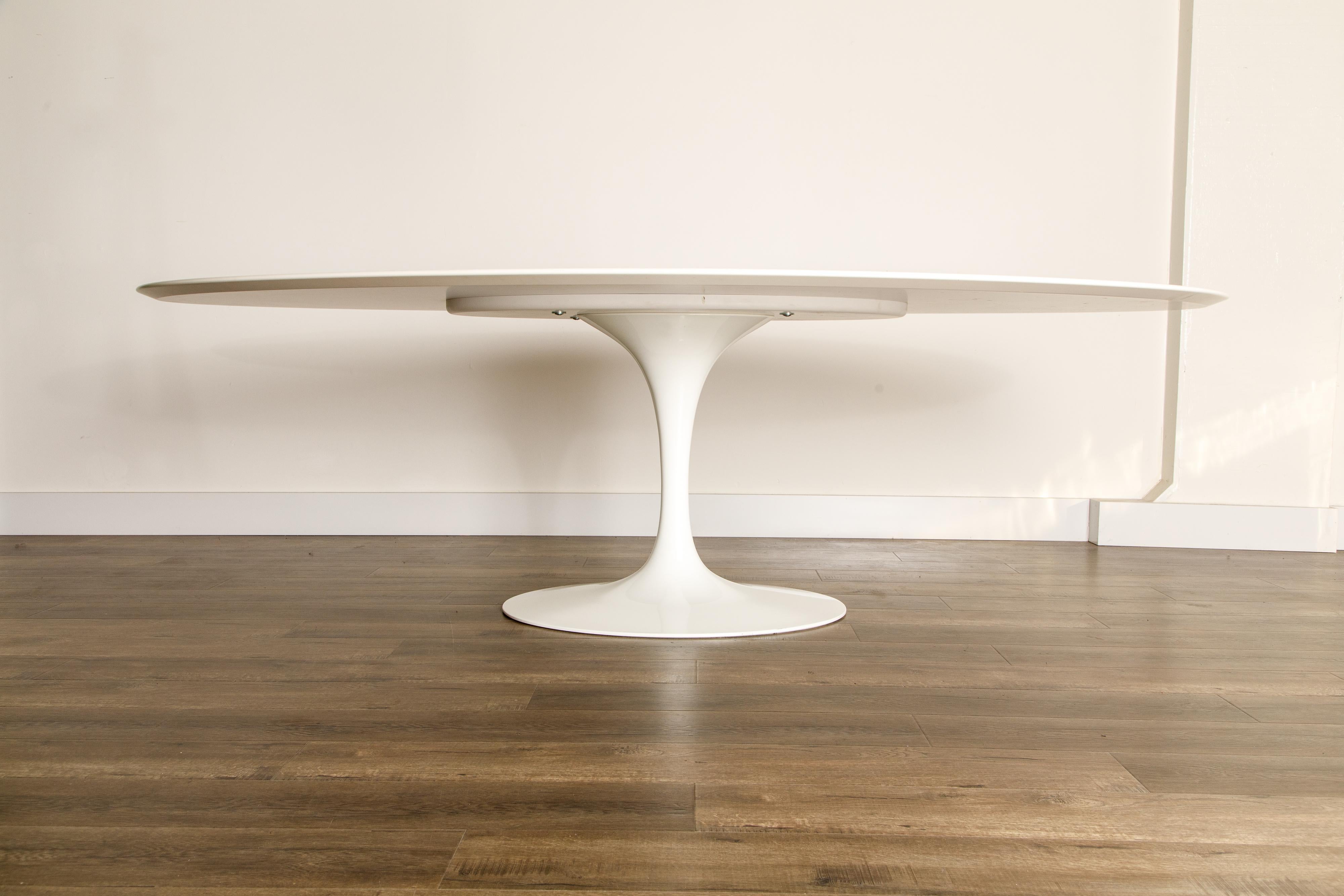 This oval Eero Saarinen for Knoll 'Tulip' pedestal dining table is the largest of the sizes they make, 96