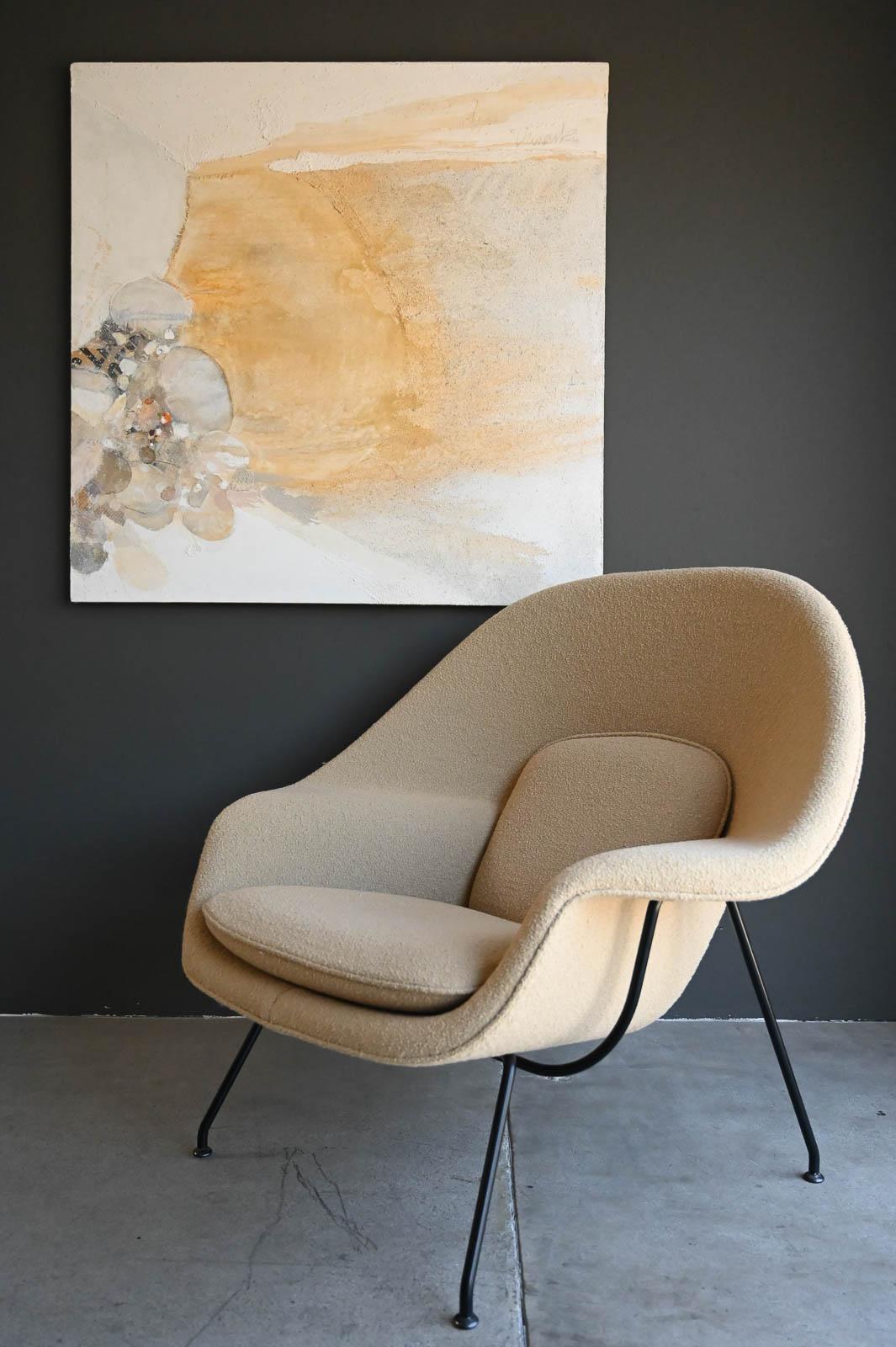 Eero Saarinen for Knoll Boucle Womb Chair, 2019.  Covered in custom Flax Boucle from Knoll.  The expressive sculptural forms of the Eero Saarinen Womb Chair (1946) can also be found in his architecture, from the TWA Terminal (now the TWA Hotel) at