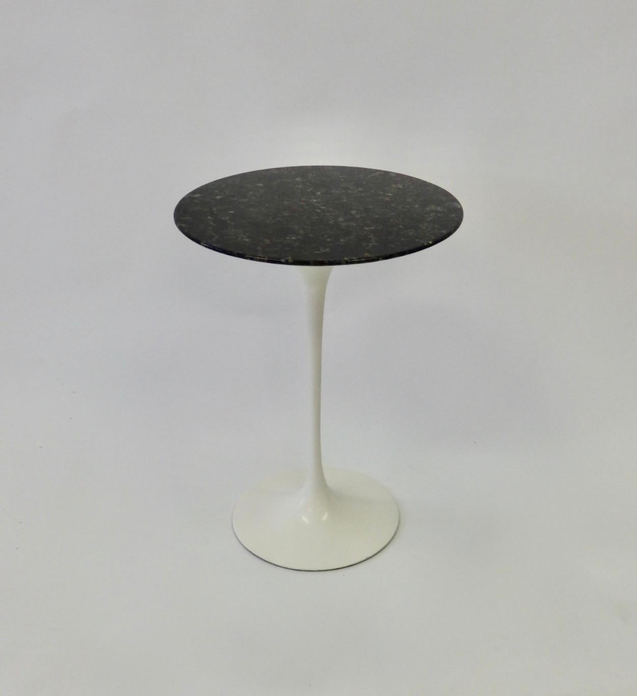 Early Knoll cast iron base with custom ordered black stone top. Eero Saarinen for Knoll Tulip group table.