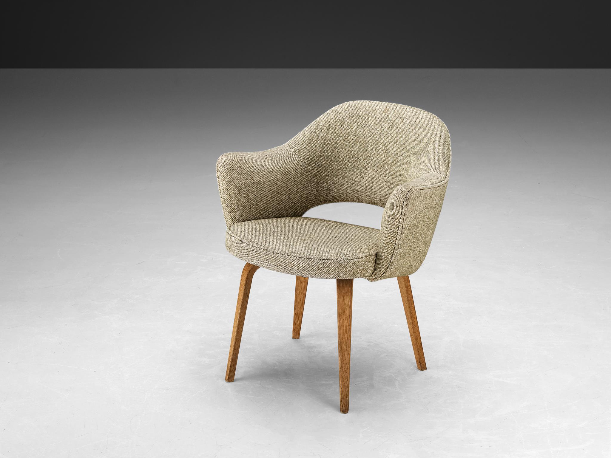 Eero Saarinen for Knoll International, dining chair, model 71, oak, fabric, United States, design 1948, later production

An organic shaped chair designed by Eero Saarinen. A fluid, sculptural form. This timeless and versatile design continues to