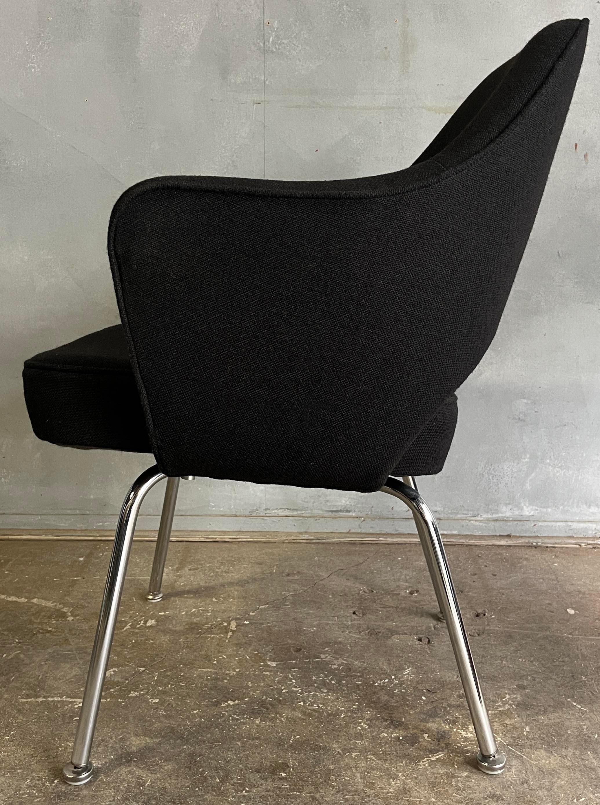 For your consideration are these Eero Saarinen for Knoll executive chairs. With black fabric and wool upholstery by Knoll. 
These are from the 60's and 70's and have been reupholstered by Citron in the 80's (a company that specialized in recovering