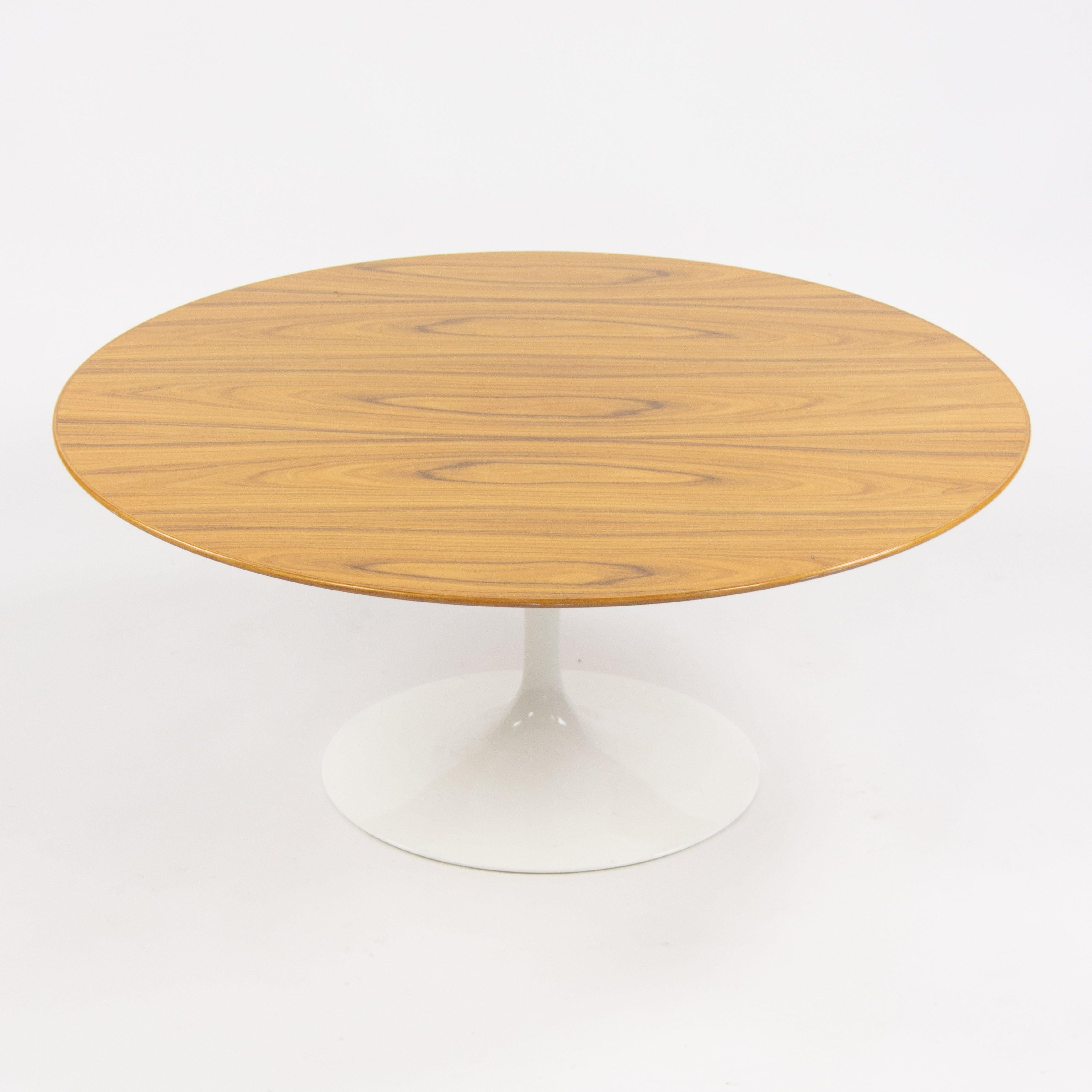 Listed for sale is one Knoll 35 inch Tulip Coffee Table, designed by Eero Saarinen.

This example has a white powder coated base with a gorgeous rosewood top. It is properly marked and guaranteed to be authentic.

The piece measures 35 inches in