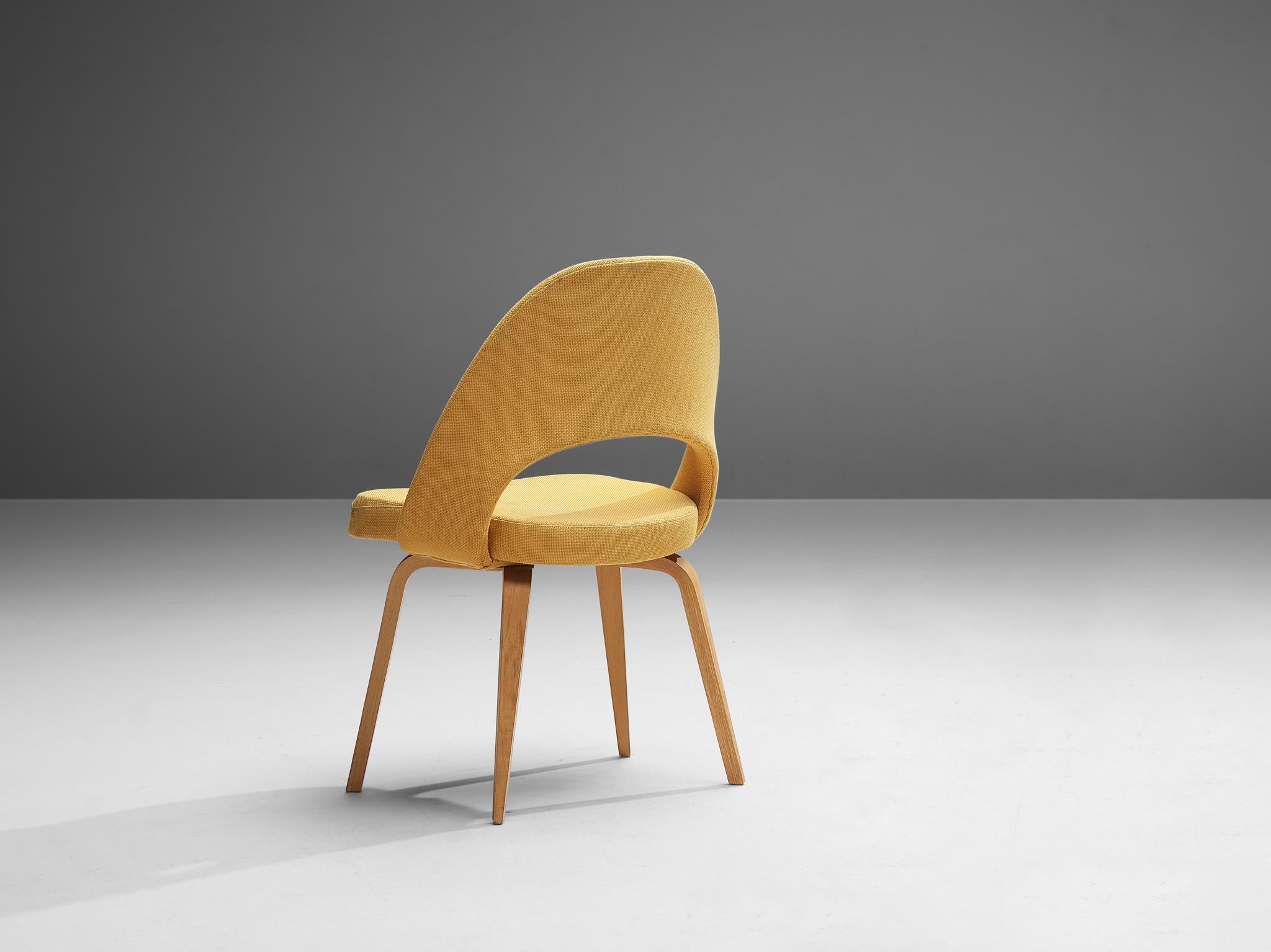 Eero Saarinen for Knoll International, dining chair model 72, wood, fabric, United States 1948. 

An organic shaped chair designed by Eero Saarinen. A fluid, sculptural form. This timeless and versatile design continues to fit seamlessly into