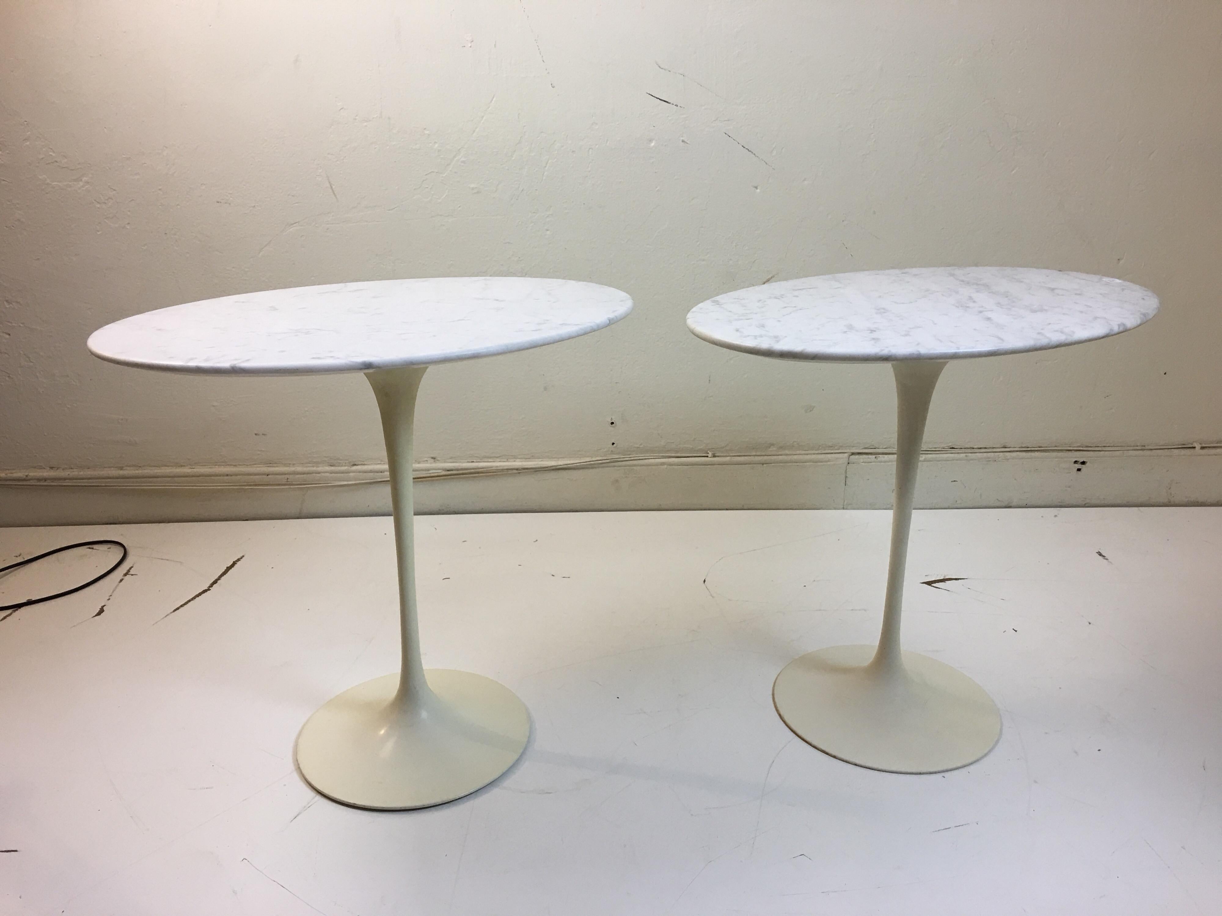 Eero Saarinen for Knoll marble oval side tables on cast iron bases. Bases form this early period are thinner than newer editions. Bought from original owner.