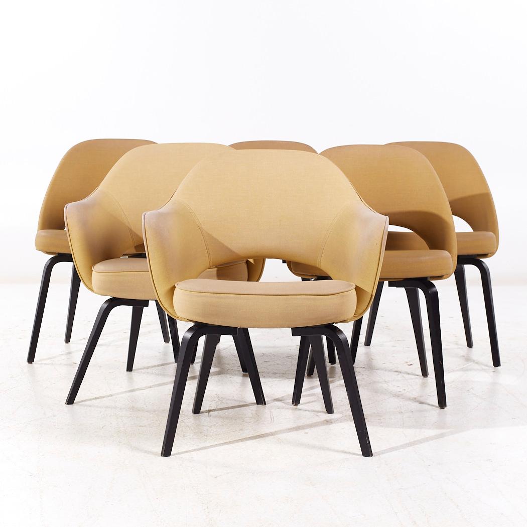Eero Saarinen for Knoll Mid Century Bentwood Executive Dining Chairs - Set of 6

Each armless chair measures: 22 wide x 21 deep x 31 high, with a seat height of 18.75 inches
Each captains chair measures: 26 wide x 24 deep x 31 high, with a seat