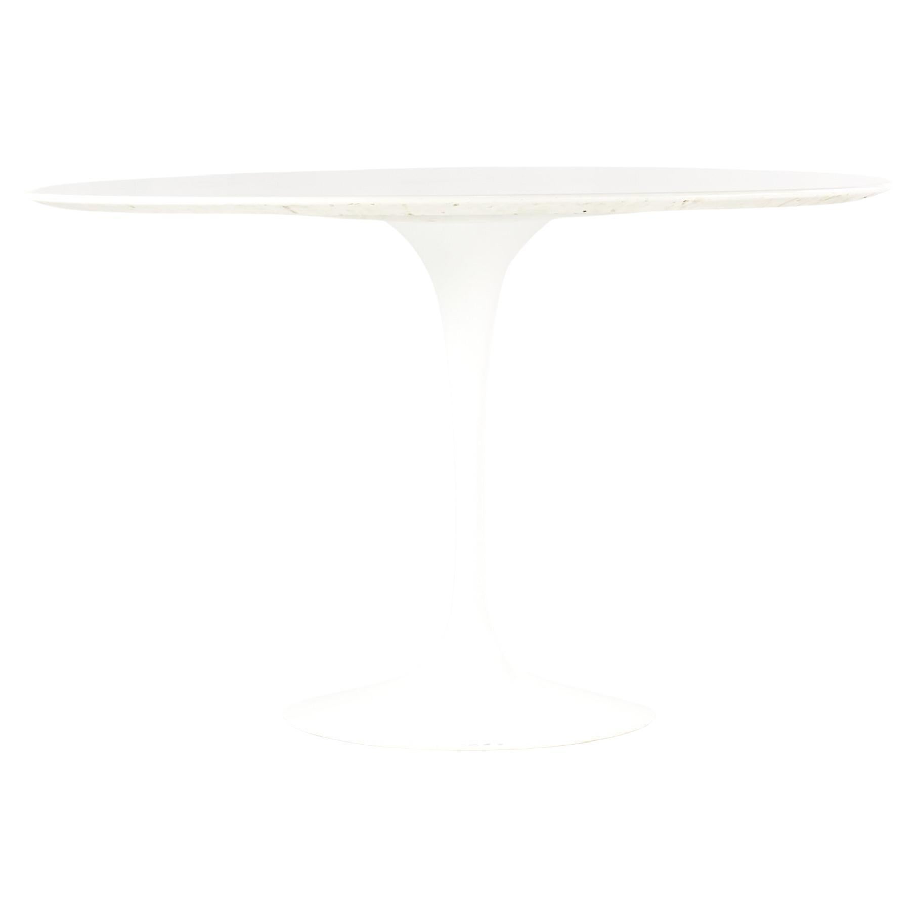 Eero Saarinen for Knoll mid century Tulip table

This dining table measures: 47.25 wide x 47.25 deep x 28.5 inches high, with a chair clearance of 27.5 inches

All pieces of furniture can be had in what we call restored vintage condition. That