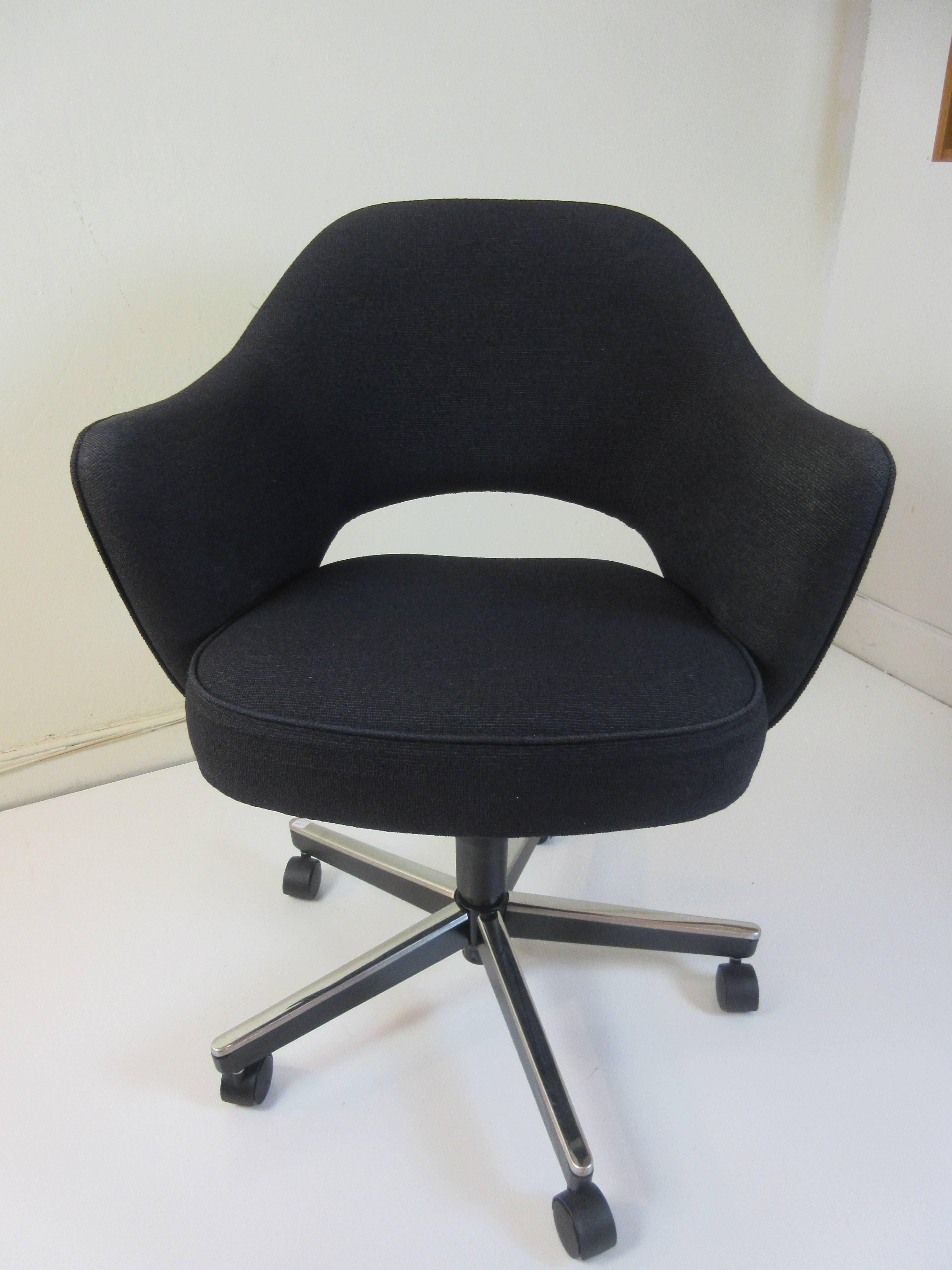 Eero Saarinen for Knoll office swivel chair with elevation adjustment in black hopsack fabric on a Osha compliant five star base. Seat raises 5.4 inches and measurements give are for the lowest.