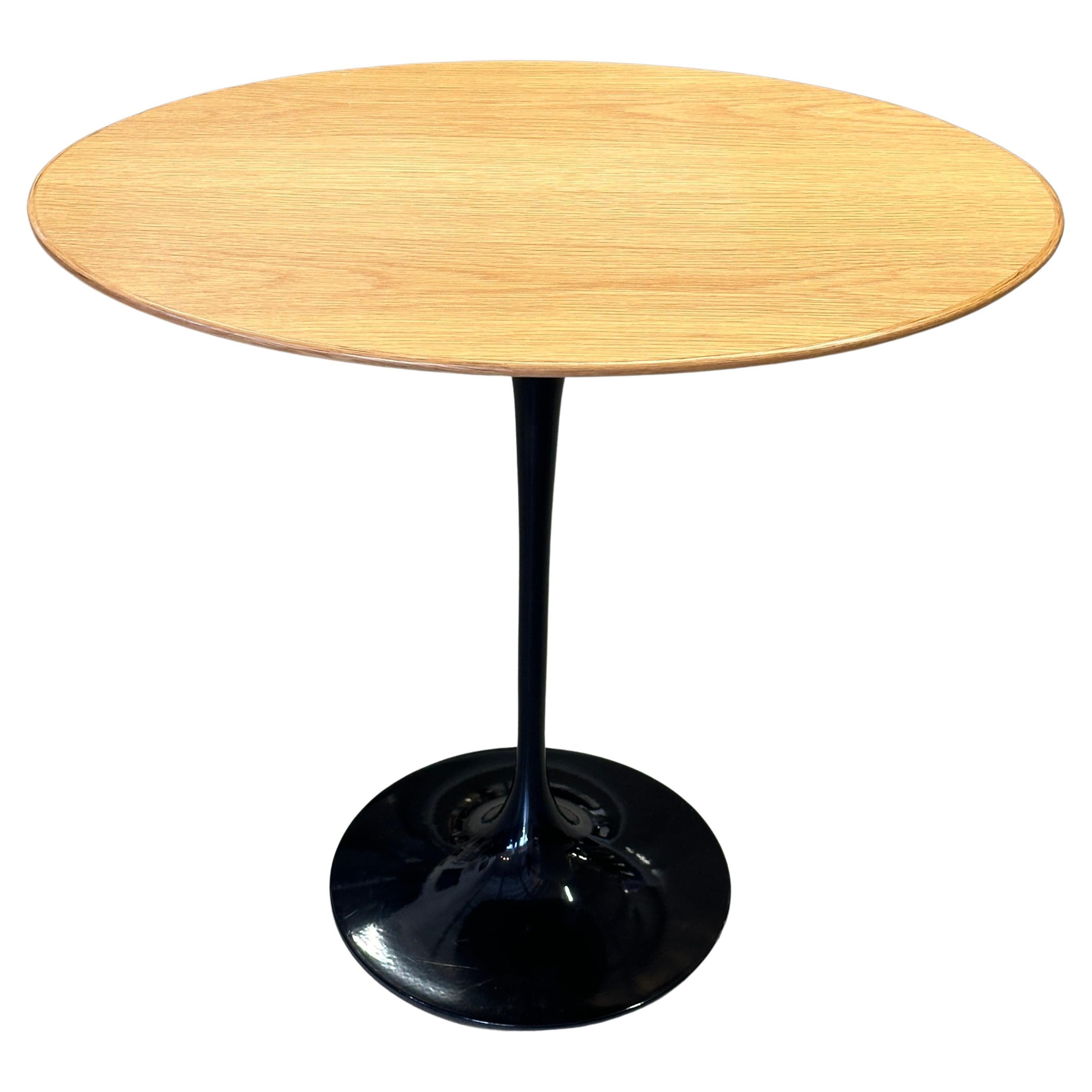 Eero Saarinen for Knoll Oval Tulip Table in Oak and Black For Sale