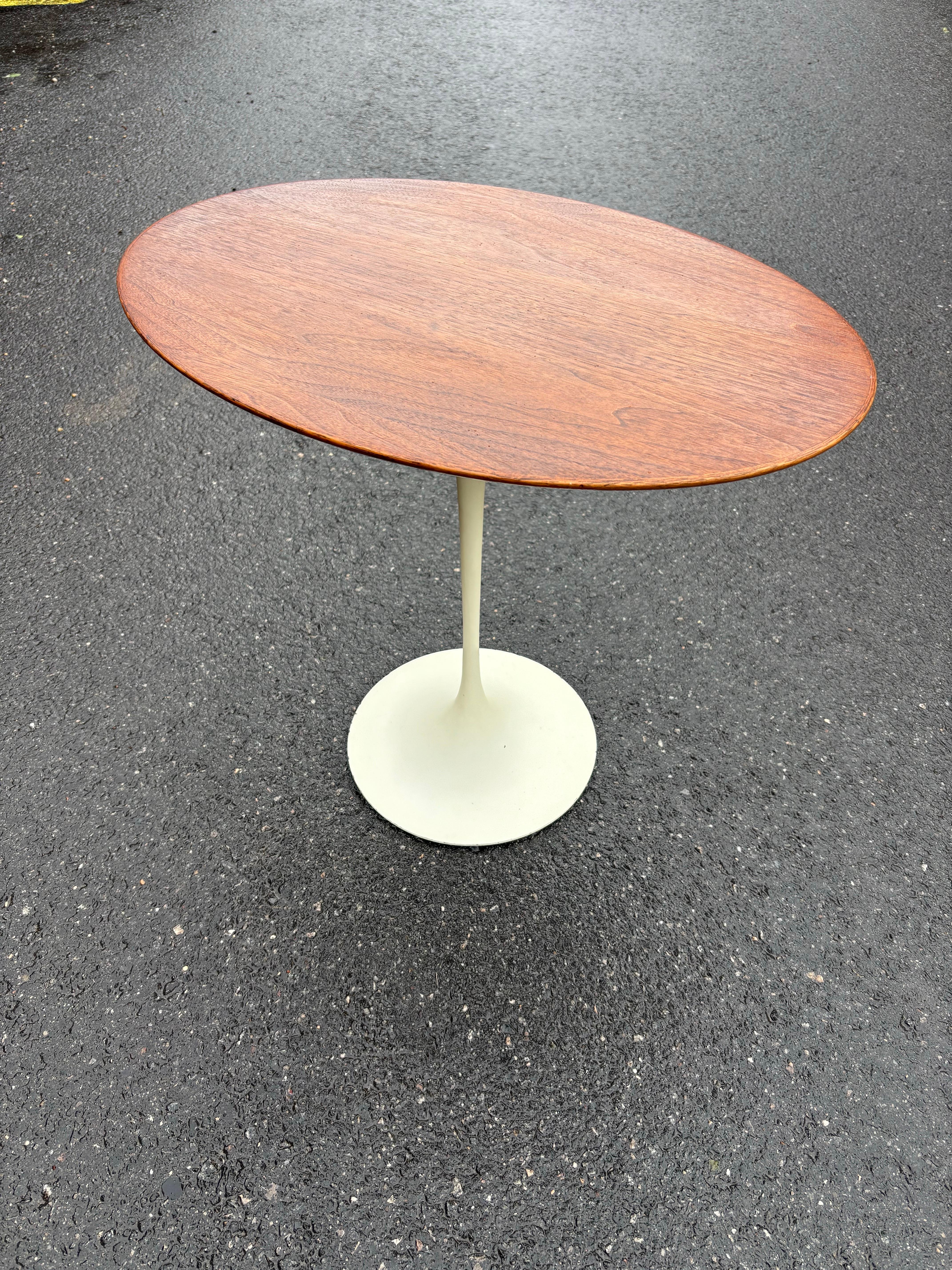 Eero Saarinen for Knoll 1960's Iron Base Oval Walnut Side Table In Good Condition For Sale In Philadelphia, PA