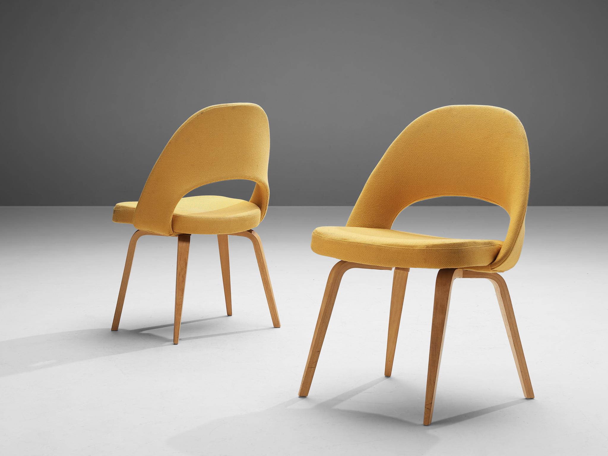Eero Saarinen for Knoll International, pair of model 72 chairs, in wood and yellow fabric, United States, design 1948

Pair of organic shaped chairs designed by Eero Saarinen. A fluid, sculptural form. This timeless and versatile design continues to