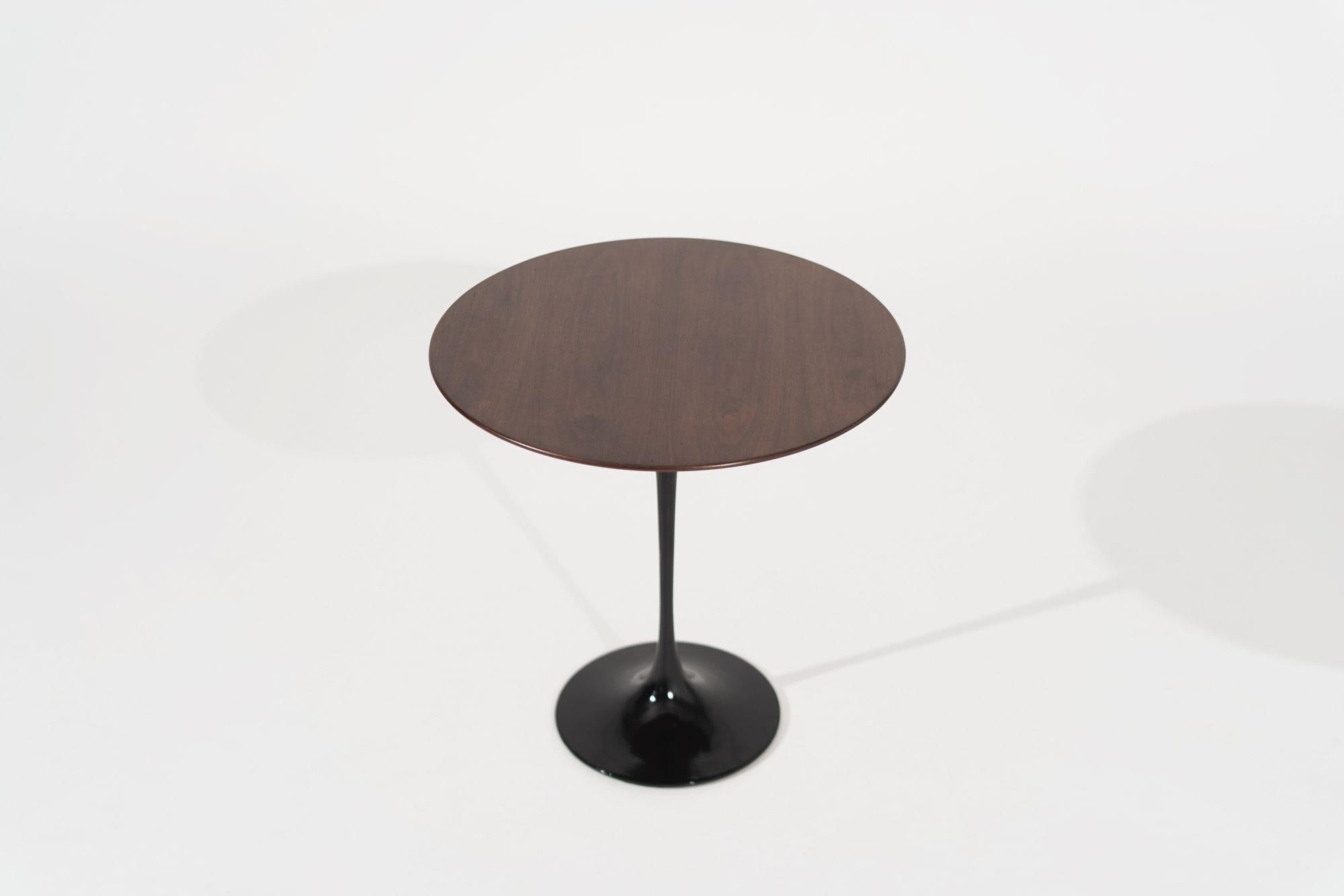 Knoll Occasional Table designed by Eero Saarinen. Base newly lacquered in black, walnut top fully restored. Very heavy early iron cast example with a higher manufacturing quality than the newer examples.
 
Other designers from this period include