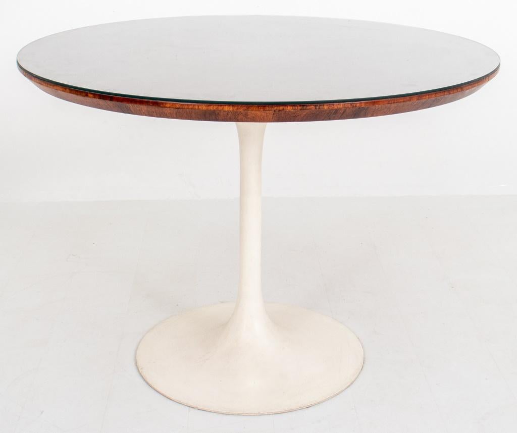 Eero Saarinen (Finnish, 1910-1961) for Knoll International, a walnut topped Tulip table, designed 1957, with glass covered walnut top and white pedestal base.

Dimensions: 29.5