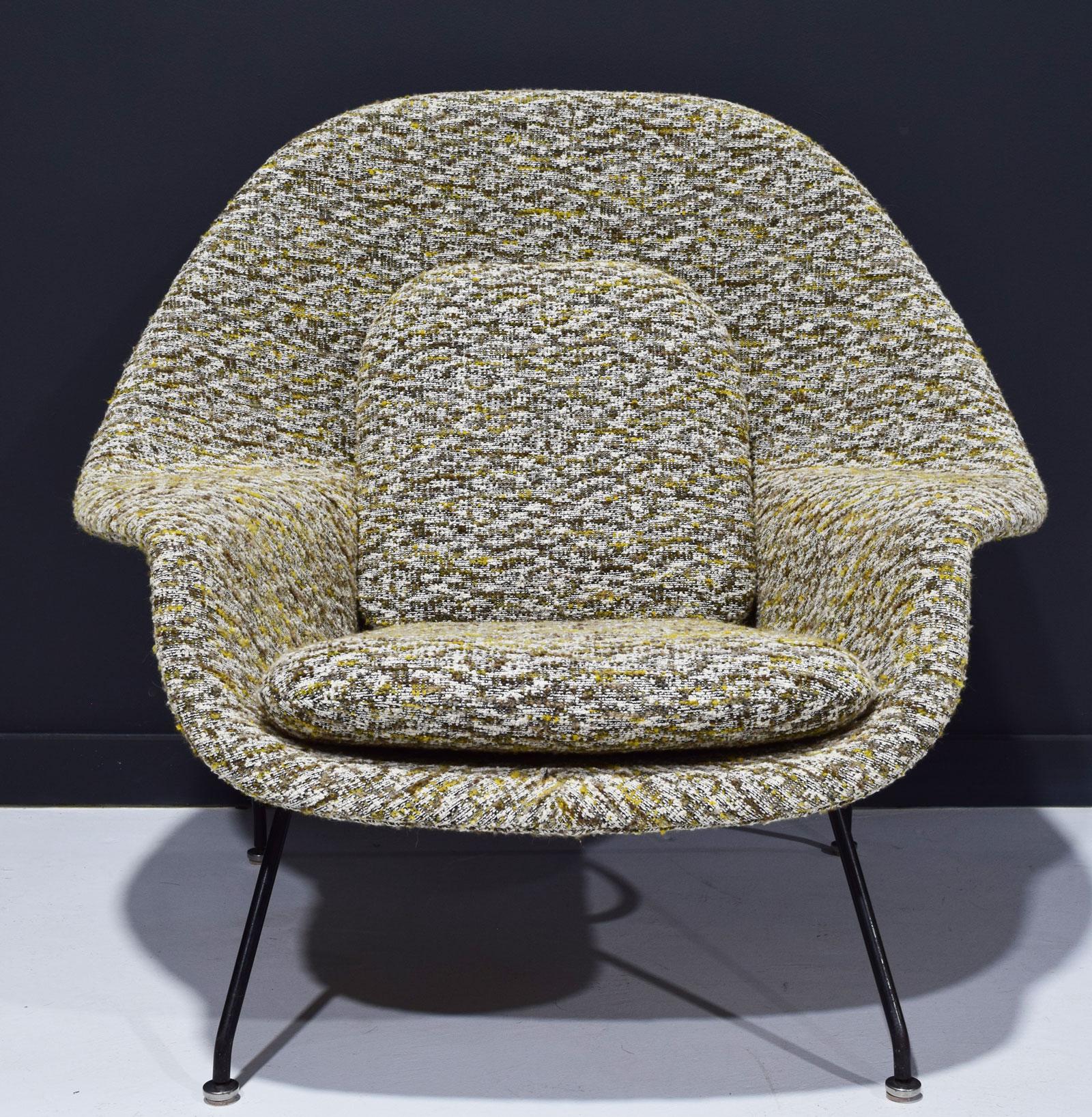 An iconic Eero Saarinen for Knoll womb chair newly upholstered in a very high-quality French bouclé. The colors include yellow/gold, sienna browns and white. This pairs beautifully with one of the Dunbar sofas we have reupholstered in yellow/dijon