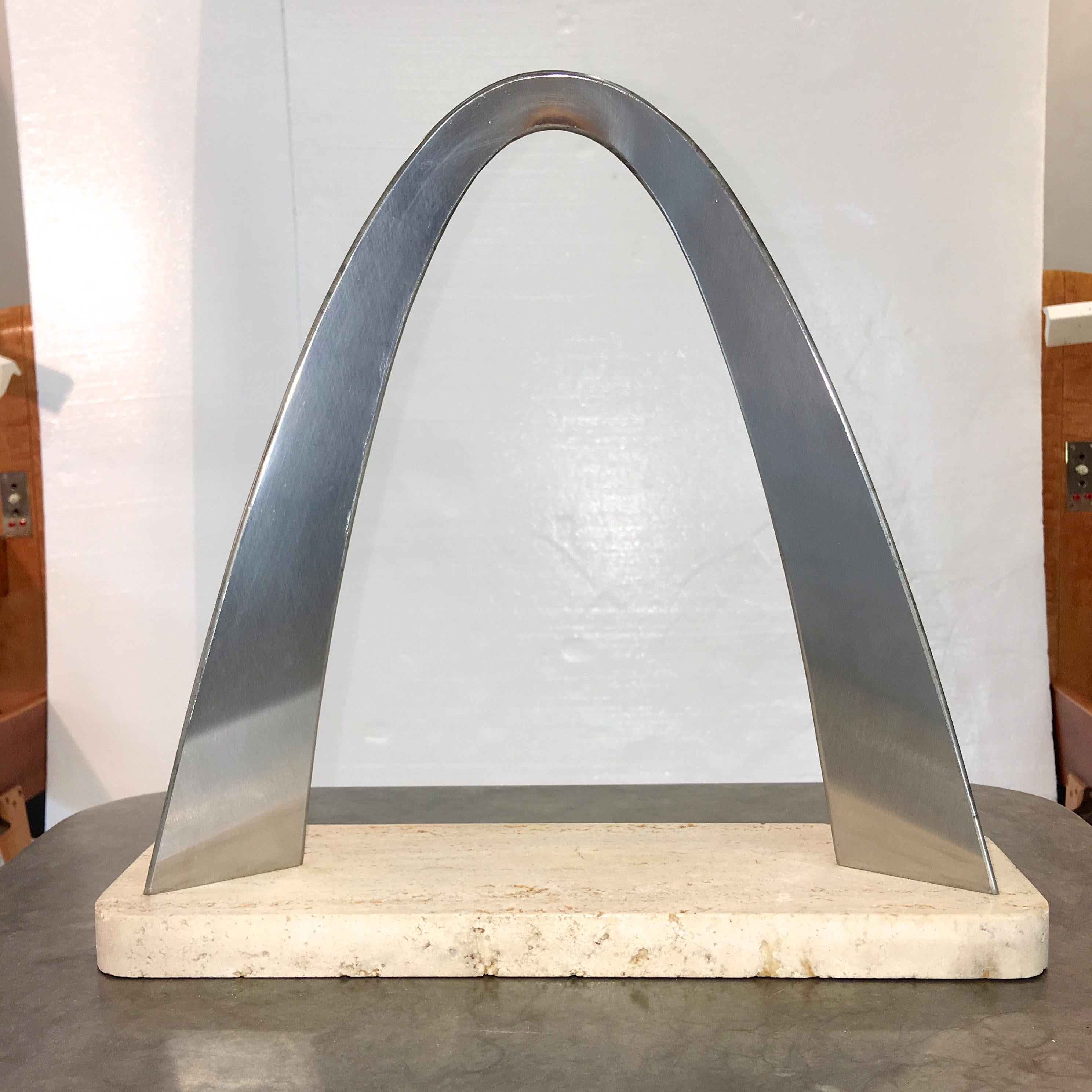 Vintage architectural scale model of Eero Saarinen's Gateway Arch in St. Louis, MO. Brushed stainless steel on travertine base. Dimensions: 13.5 in x 13.5 in x 4 in.

The Gateway Arch is a 630-foot (192 m) monument in St. Louis in the U.S. state