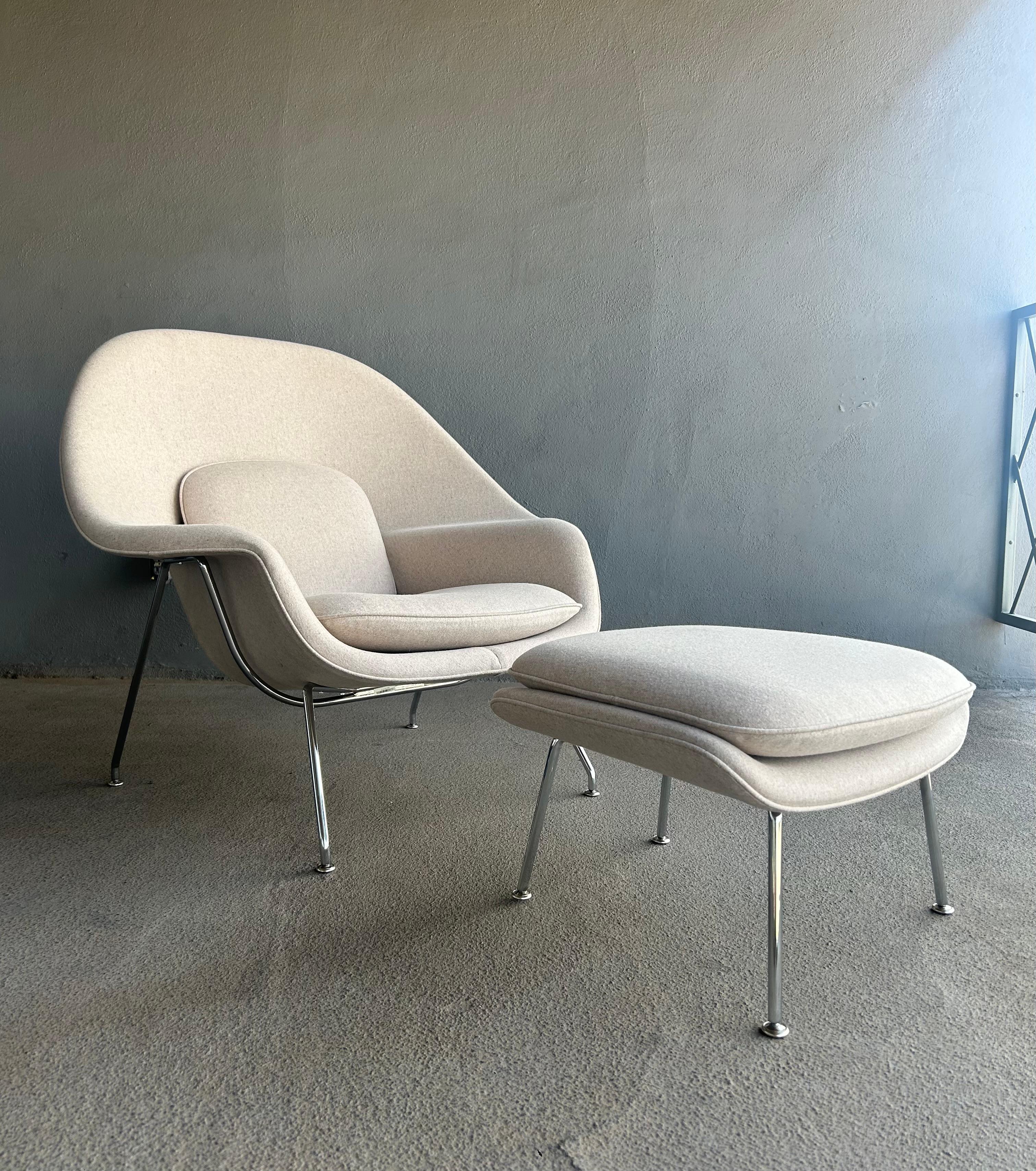 Knoll Womb chair & ottoman (designed by Eero Saarinen) for Knoll in a multi-colored wool that visually translates as a soft off-white neutral. 